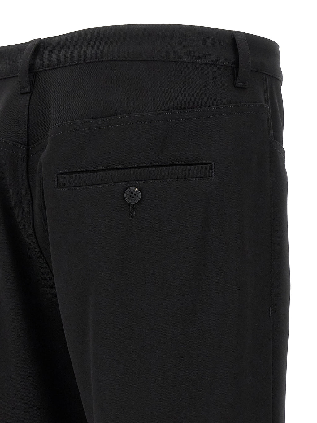 Pantalon habillé en laine noire de Balenciaga, style élégant et moderne, visible en détail dans l'image.