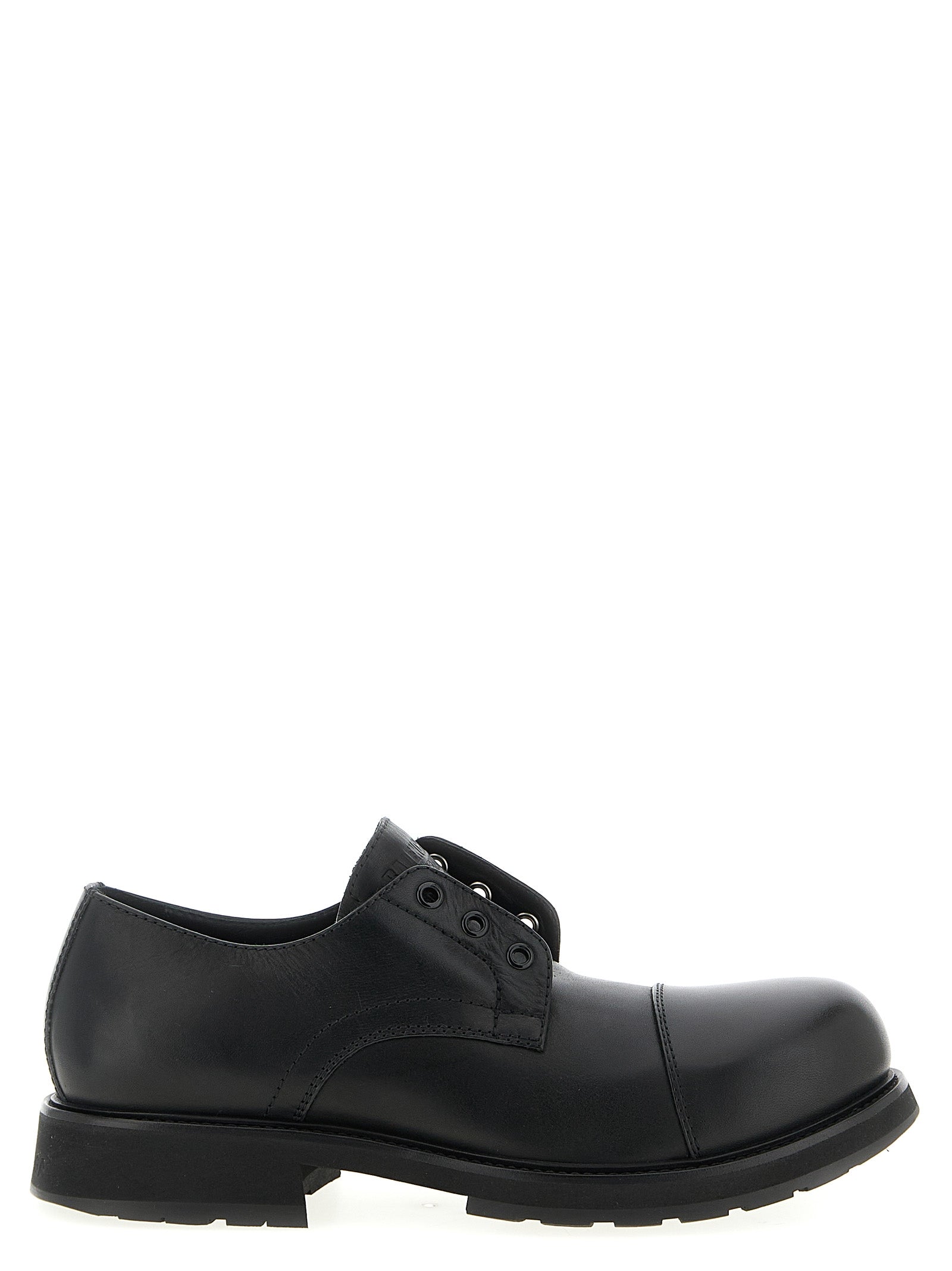Chaussures slip-on Balenciaga en peau de taureau noire, élégantes mocassins sans lacets pour homme.