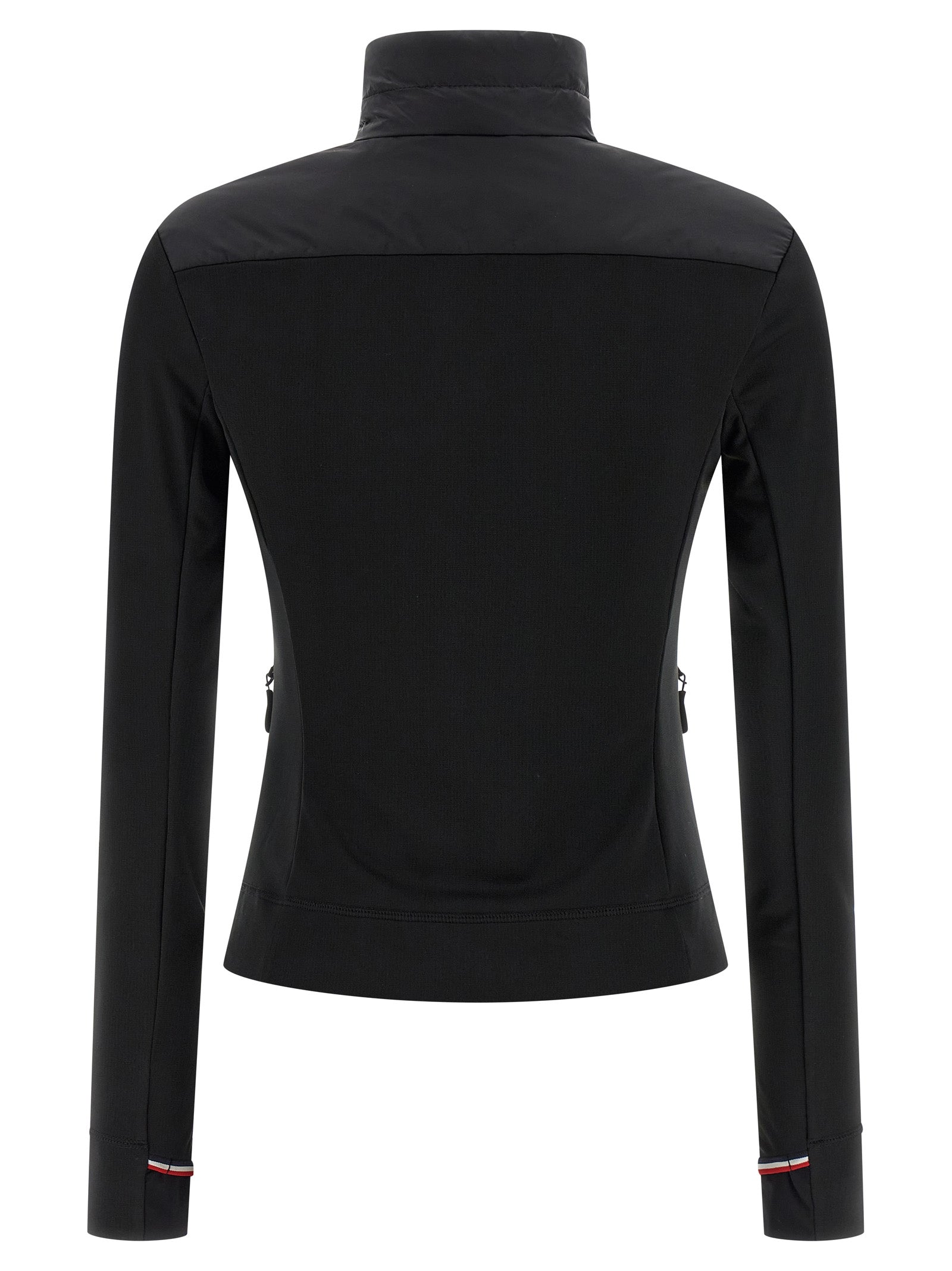 Cardigan noir en polyamide Moncler Grenoble, léger et chaud, avec détails de fermeture et textures visibles.