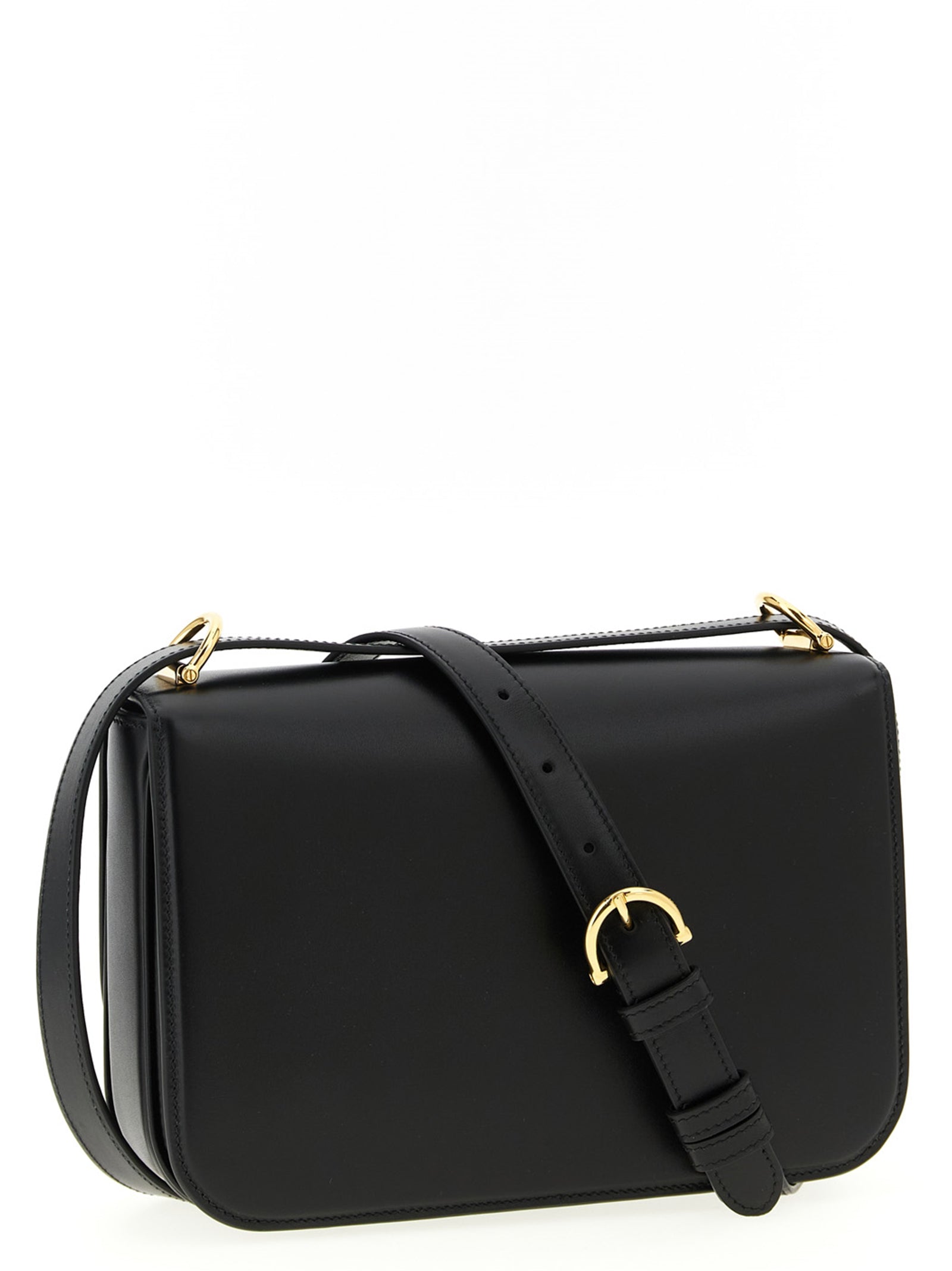 Sac à bandoulière en cuir de veau noir de Gucci, avec détails élégants et fermeture métallique visible.