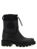 Bottes Moncler noires en PVC, ankle hautes, avec semelle antidérapante et design élégant.