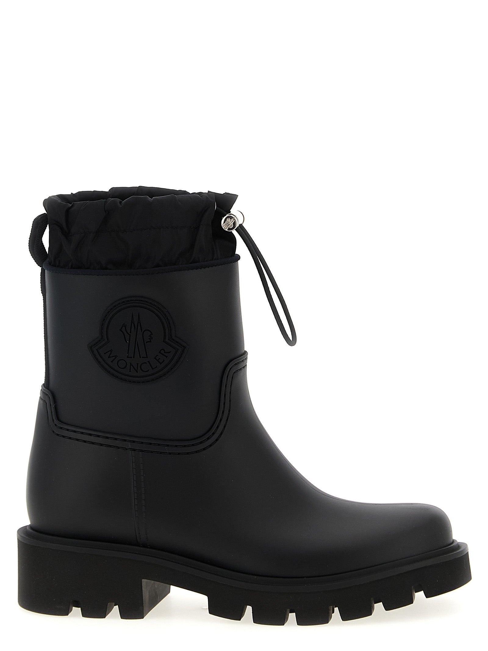 Bottes Moncler noires en PVC, ankle hautes, avec semelle antidérapante et design élégant.