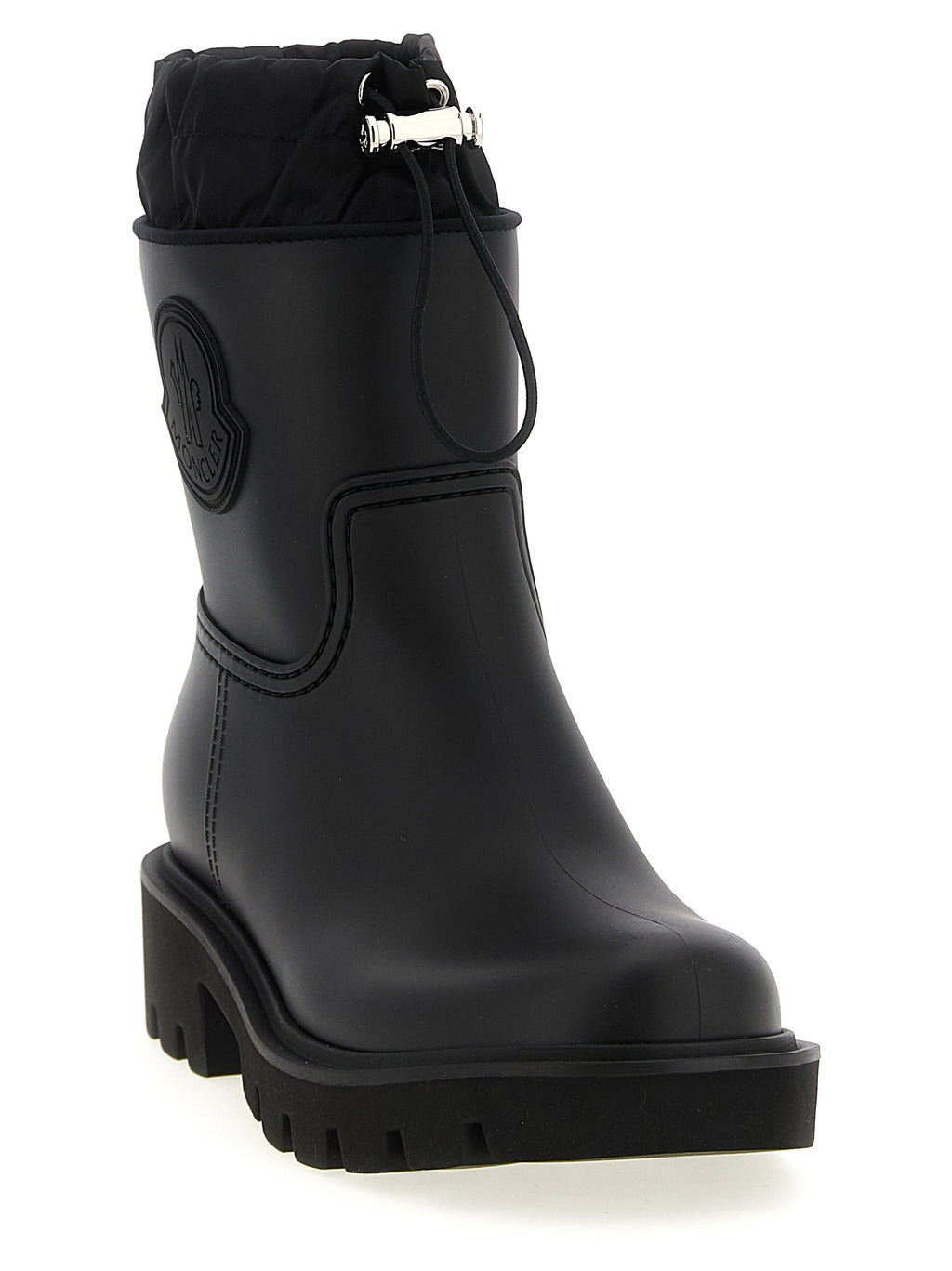 Bottes ankle en PVC noire Moncler, style élégant et moderne, avec fermeture à glissière sur le côté.