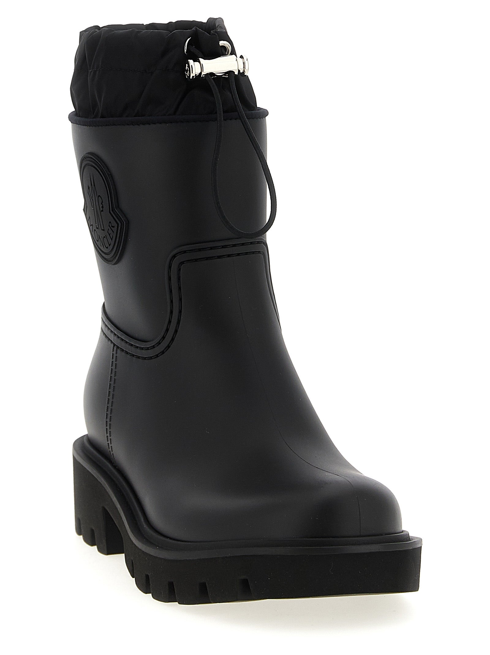 Bottes ankle en PVC noire Moncler, style élégant et moderne, avec fermeture à glissière sur le côté.