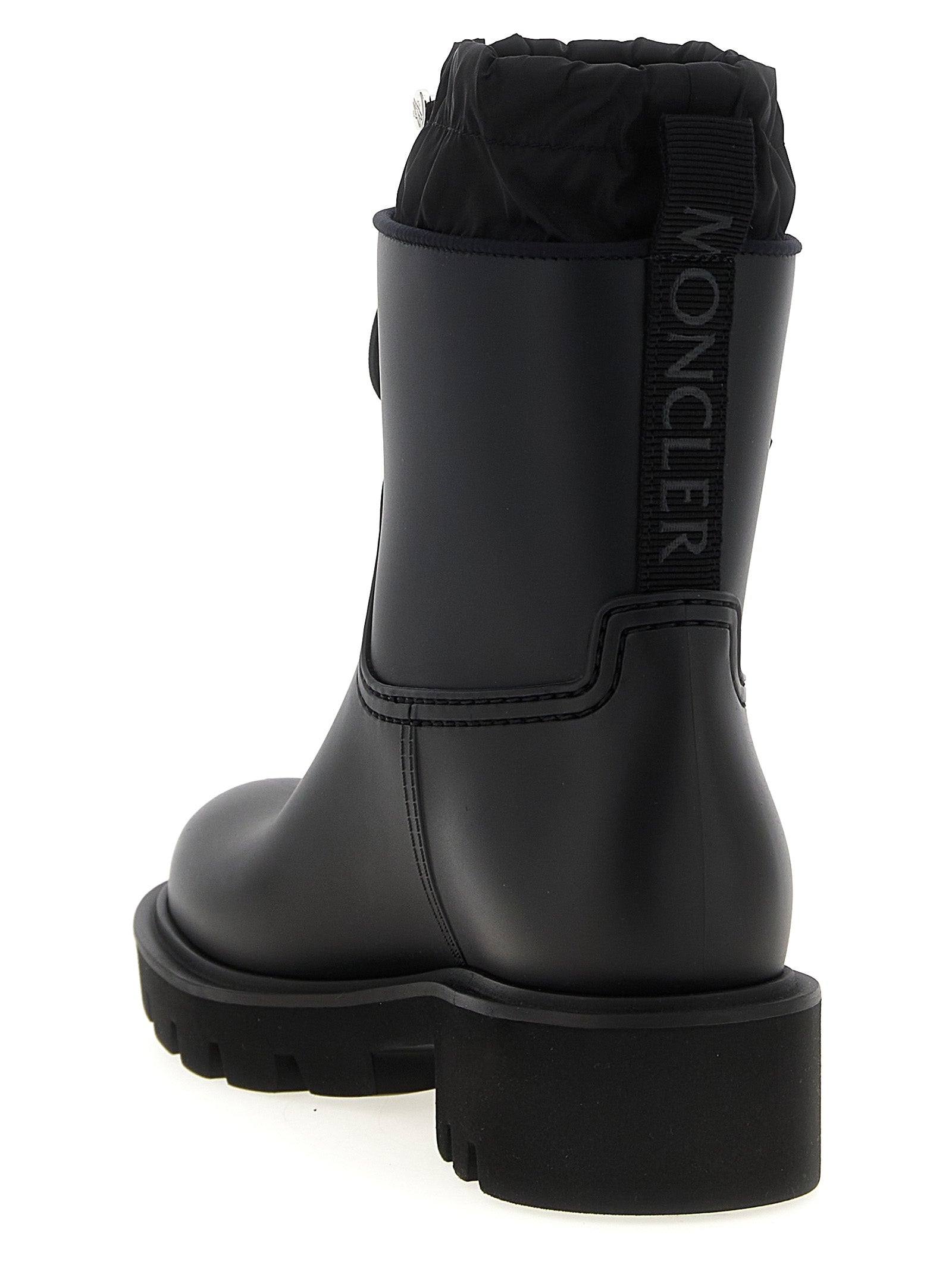 Bottes ankle en PVC noires de Moncler, style moderne, avec semelle épaisse et design résistant à l'eau.