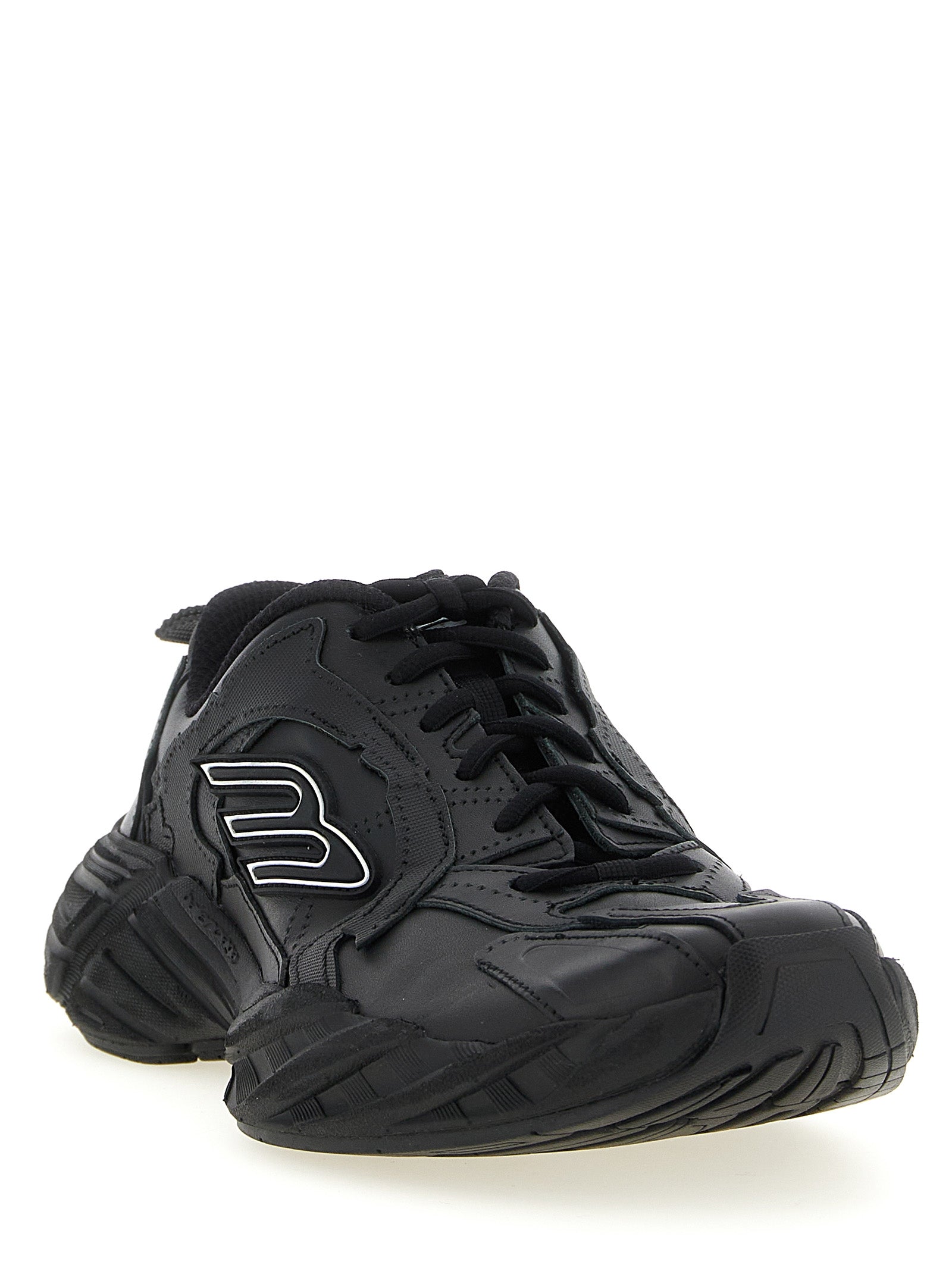 Chaussures de sport Balenciaga en cuir de veau noir, baskets athlétiques élégantes et modernes.