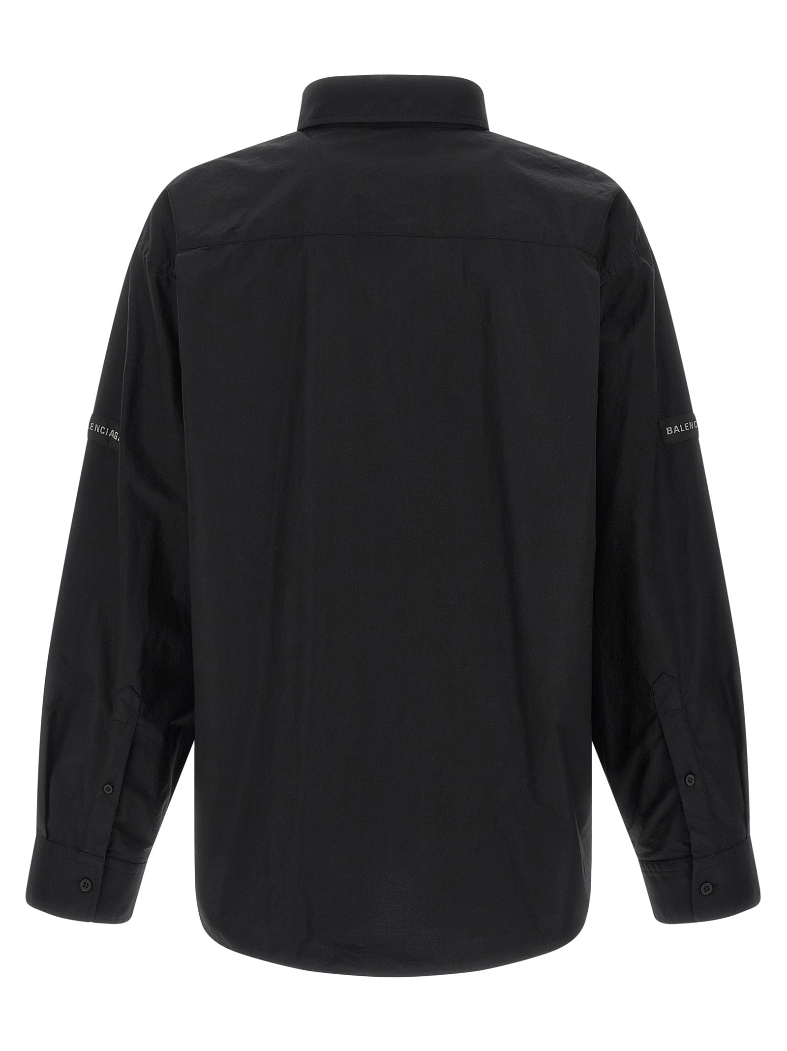 Chemise en coton noire Balenciaga avec coupe élégante et détails modernes, vue de face sur fond neutre.