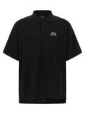 Chemise polo noire en coton de Balenciaga, vue de face, avec col classique et logo discreet en détail.