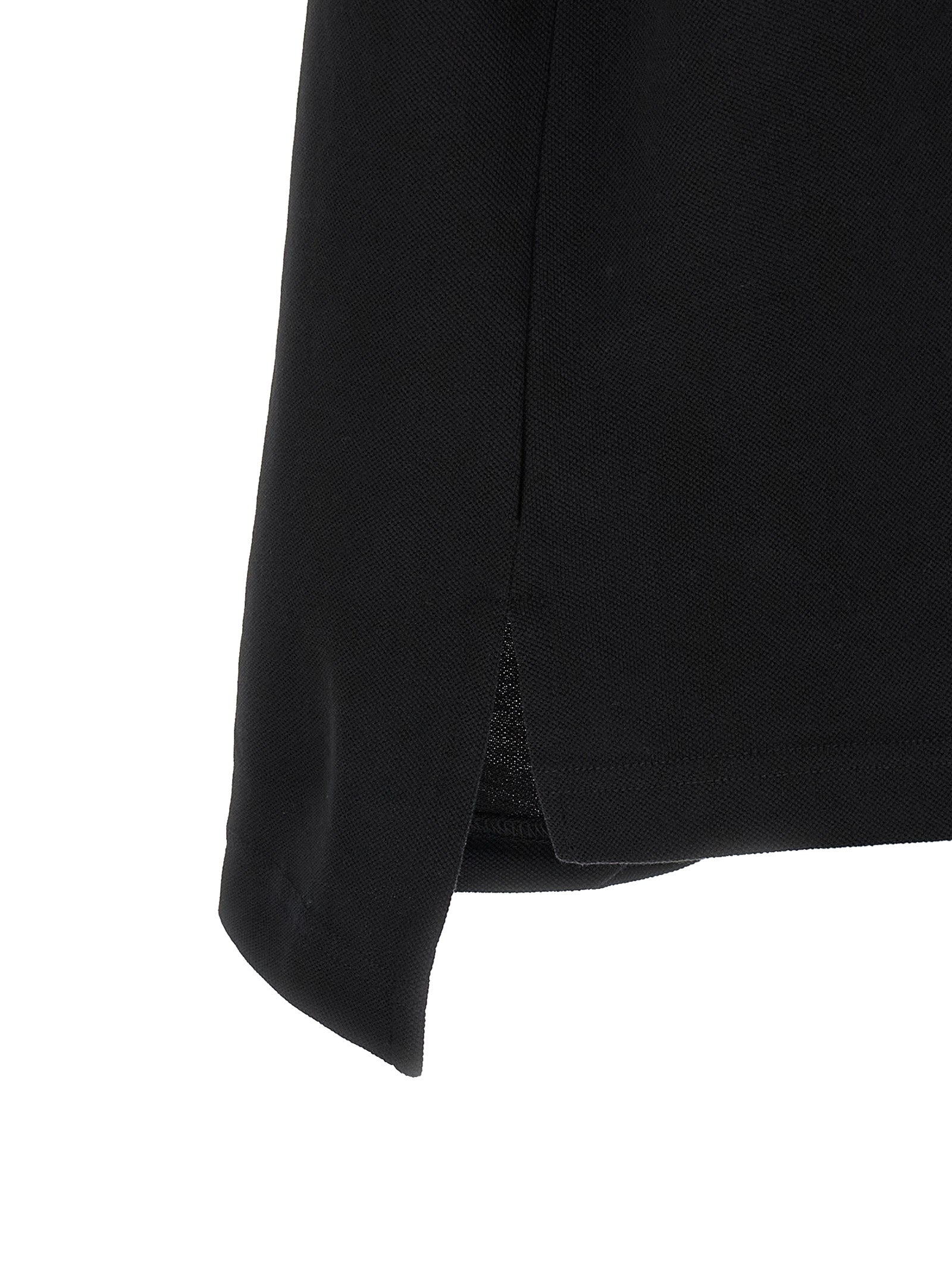 Chemise polo noire en coton de Balenciaga, vue de face, avec col classique et logo discret sur la poitrine.