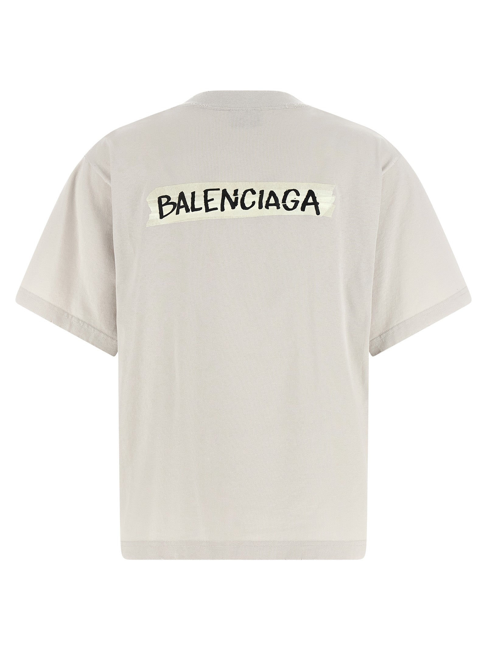 T-shirt en coton gris de Balenciaga, vêtement décontracté avec logo de la marque visible, porté par un mannequin.