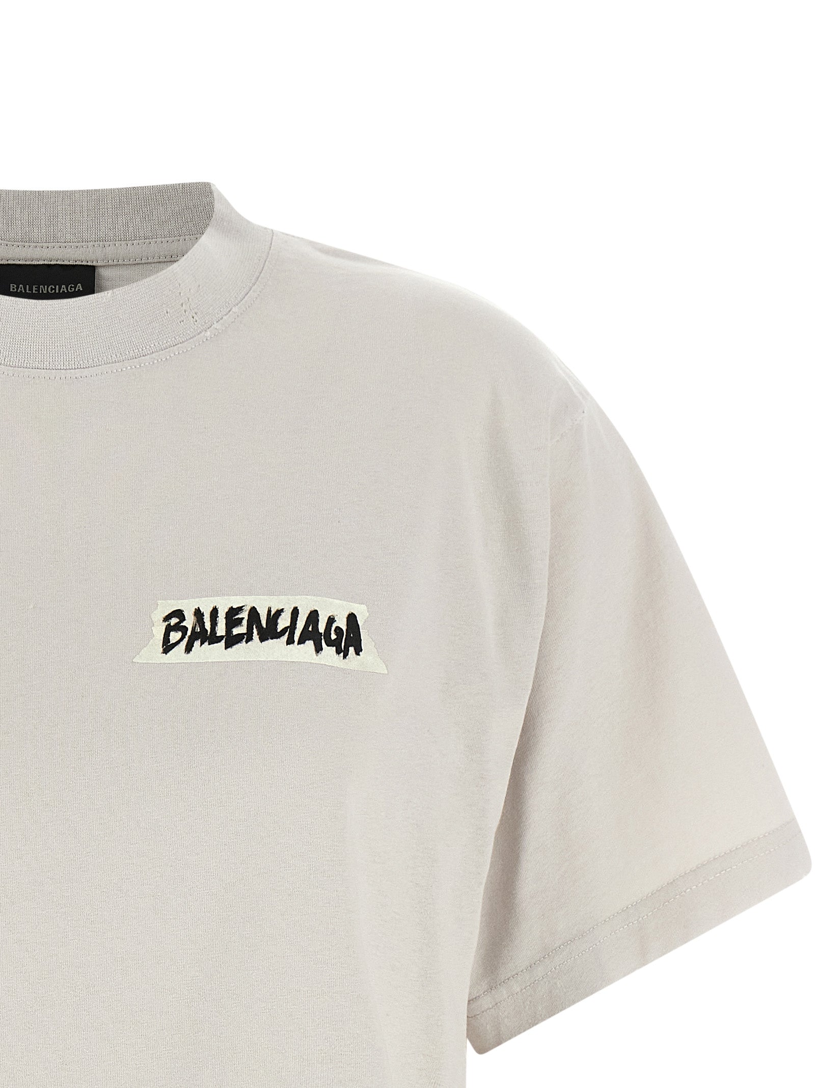 T-shirt gris en coton de la marque Balenciaga, design décontracté avec logo visible sur le devant.