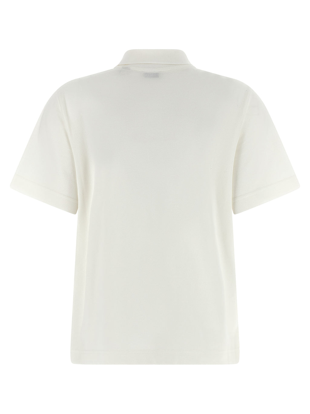 Chemise polo blanche en coton de la marque Burberry, avec col et boutons, portée dans un style décontracté.