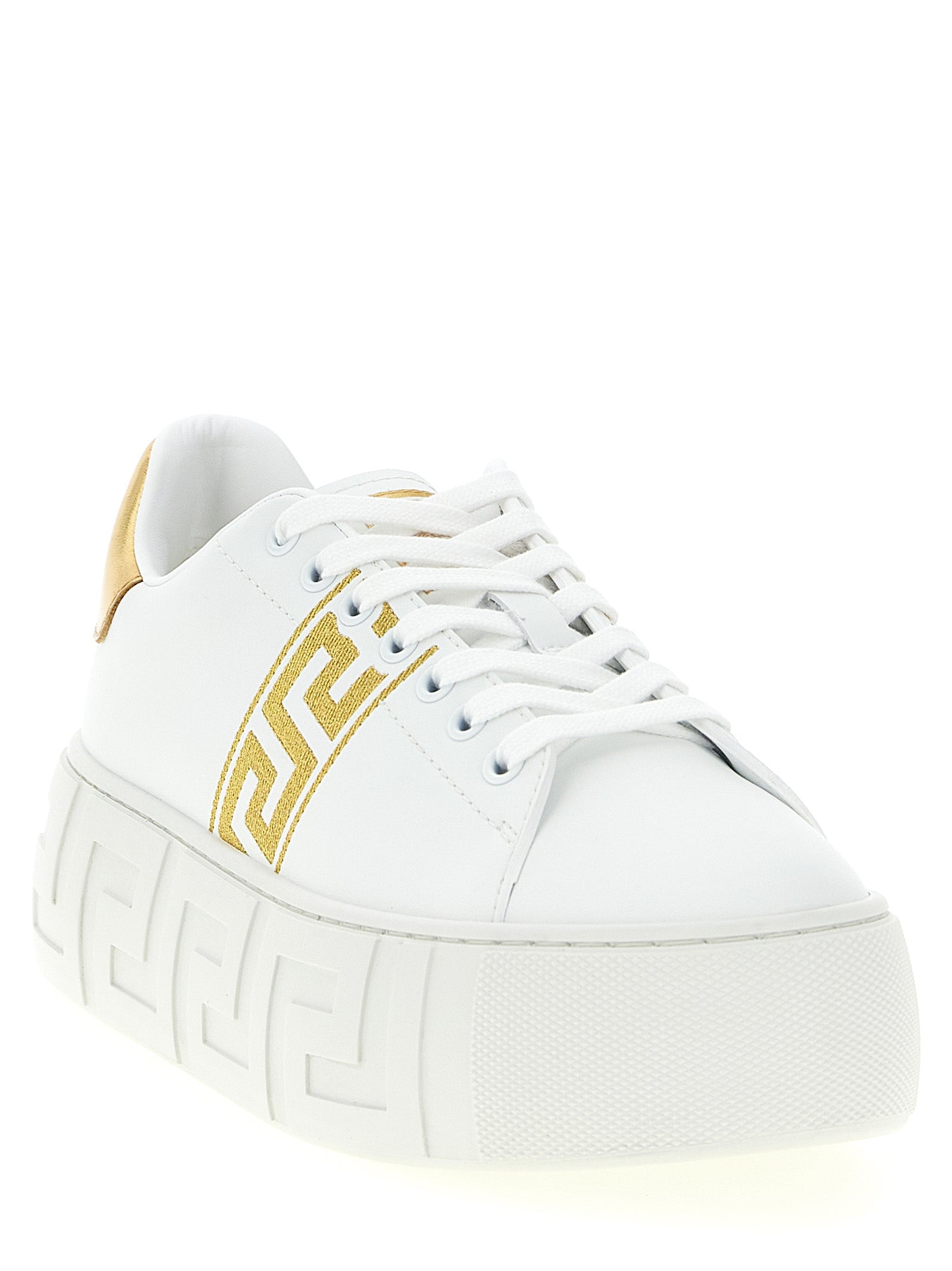 Chaussures plateformes en nylon doré de Versace, sneakers de style sport avec logo Versace visible.
