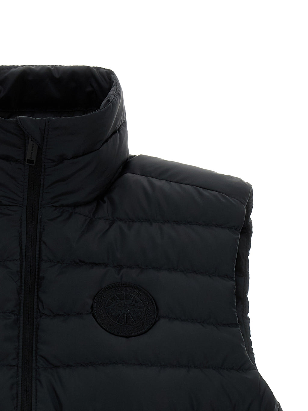 Doudoune sans manches noire en polyamide de Canada Goose, légère et résistante, avec capuche amovible et fermeture à glissière.