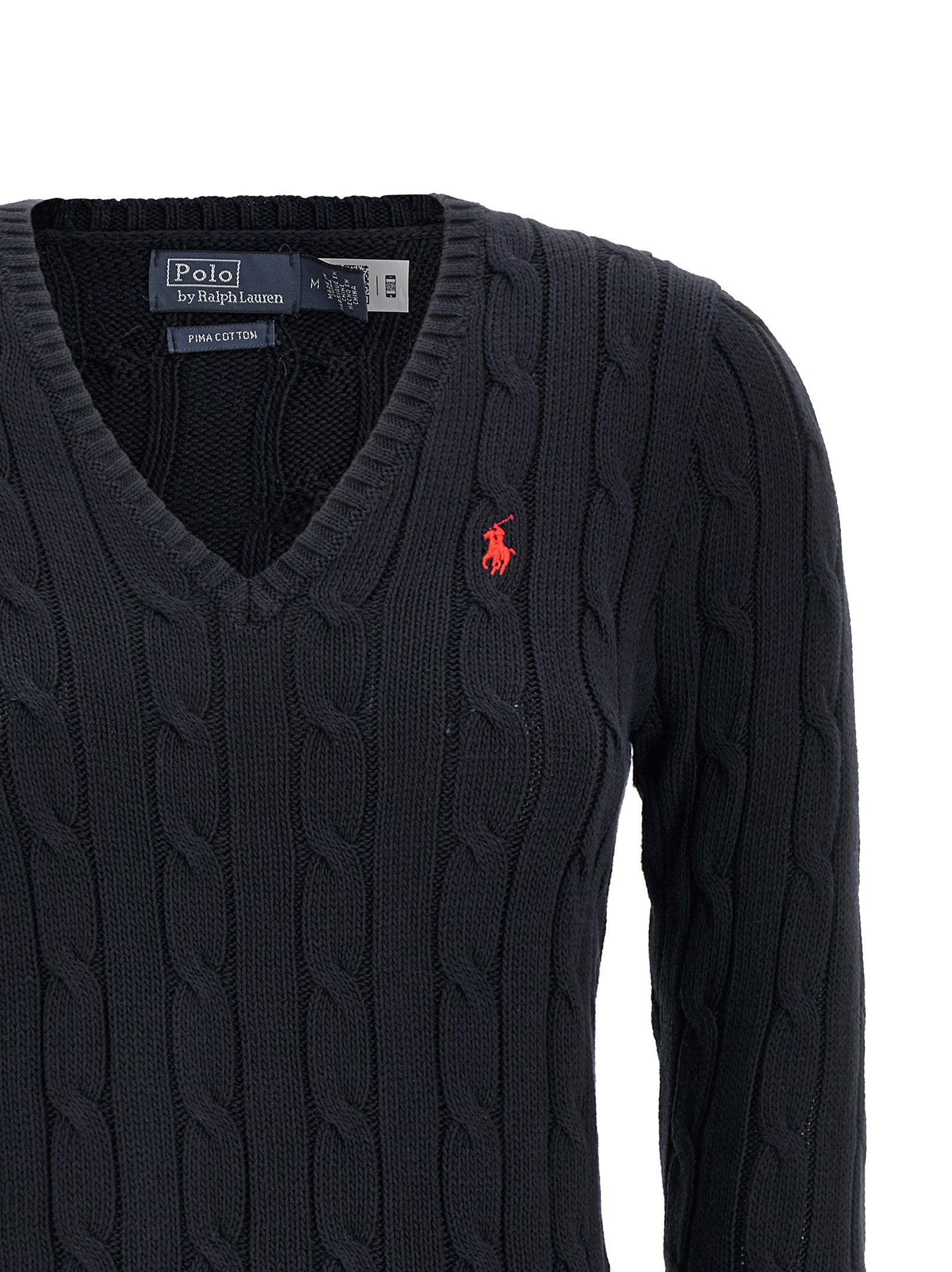 Cardigan en coton bleu Polo Ralph Lauren porté sur un mannequin, détails du col et des boutons visibles.