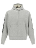 Sweat-shirt gris en coton de Balenciaga, style décontracté avec logo discret, porté sur mannequin.