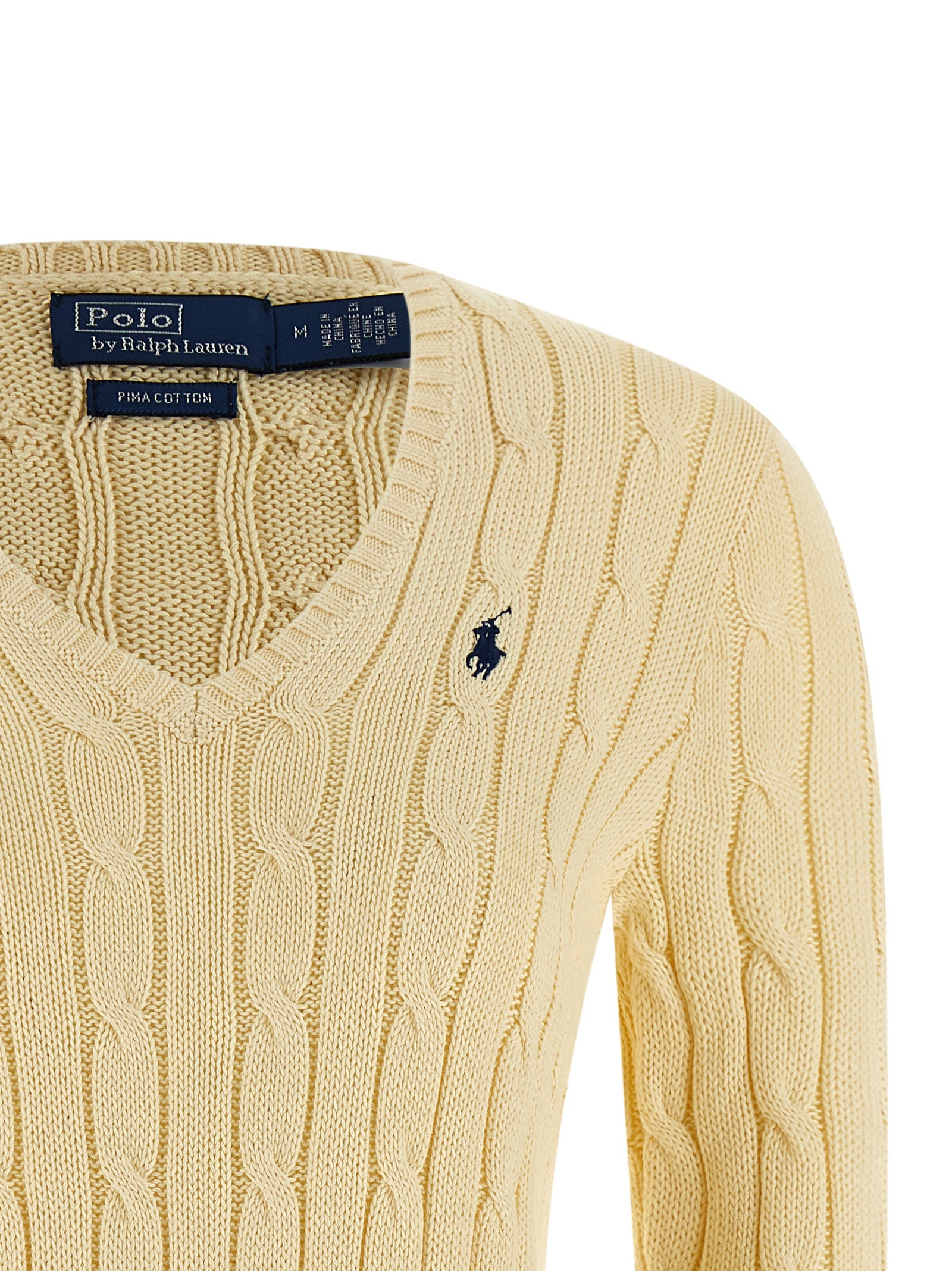 Cardigan bicolore en coton de la marque Polo Ralph Lauren, détail du col et des boutons, porté avec un style décontracté.