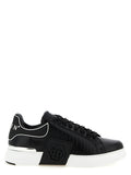 Baskets basses Philipp Plein en cuir de vache noire, style décontracté et tendance, avec détails en relief et logo de la marque.