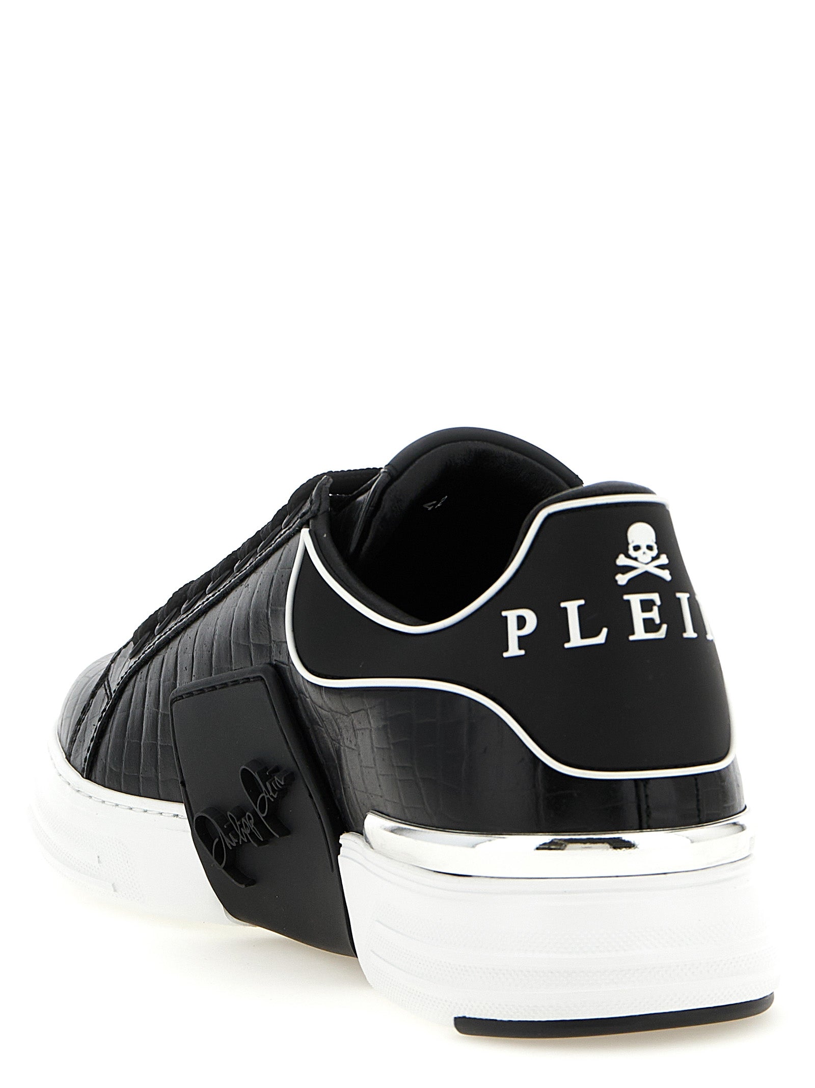Chaussures Philipp Plein en cuir noir, baskets basses en peau de vache, design élégant et moderne pour homme.