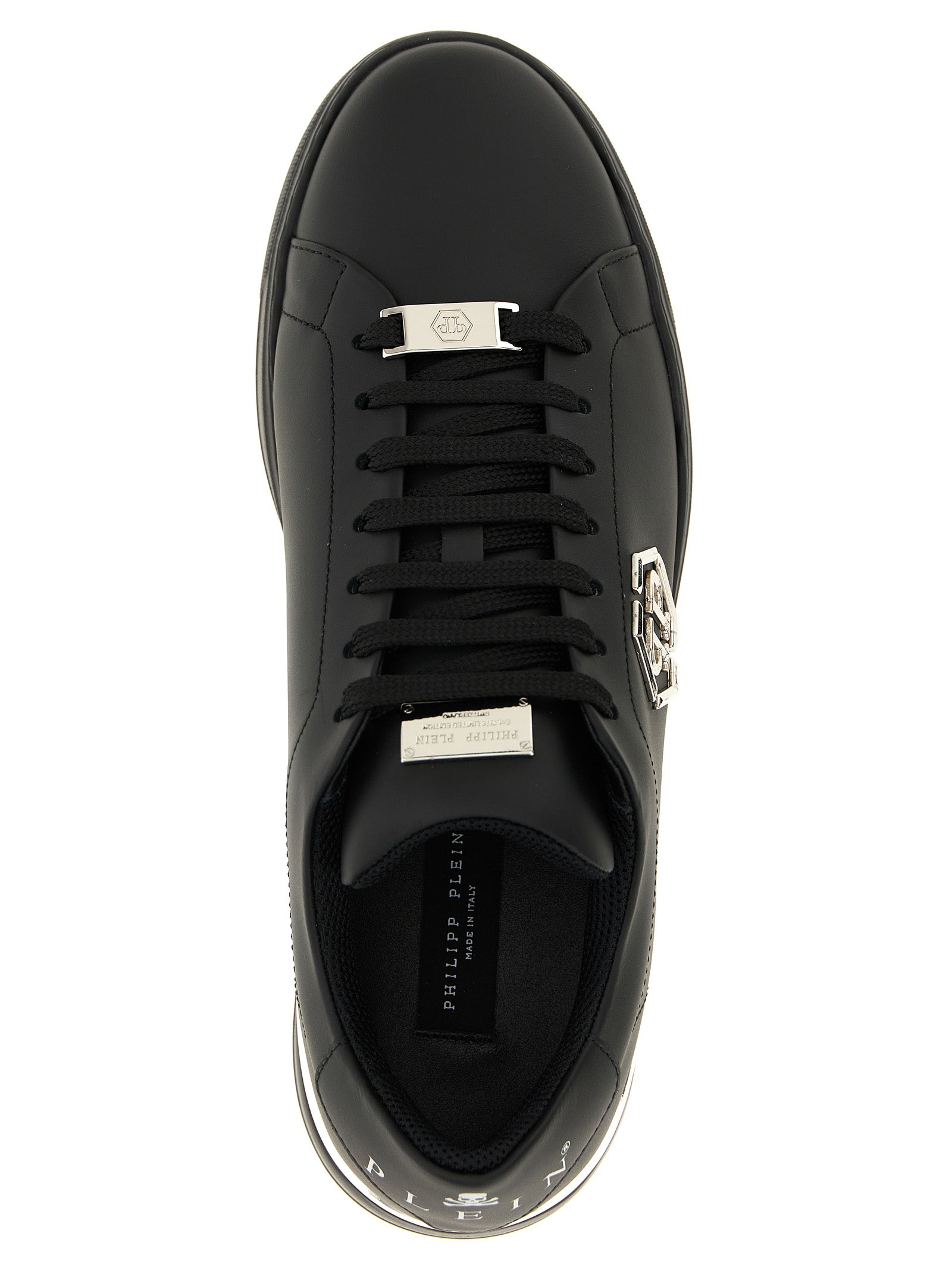 Chaussures basses Philipp Plein en cuir de veau noir, sneakers décontractés avec détails modernes et logo visible.