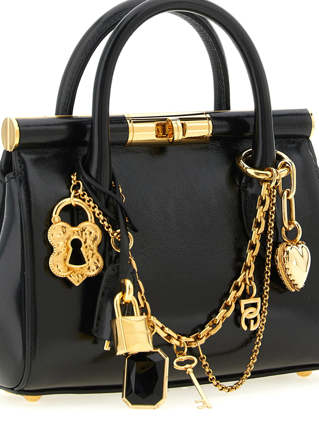 Sac à main en cuir de veau noir de Dolce & Gabbana, élégant et sophistiqué, avec détails en or et design classique.