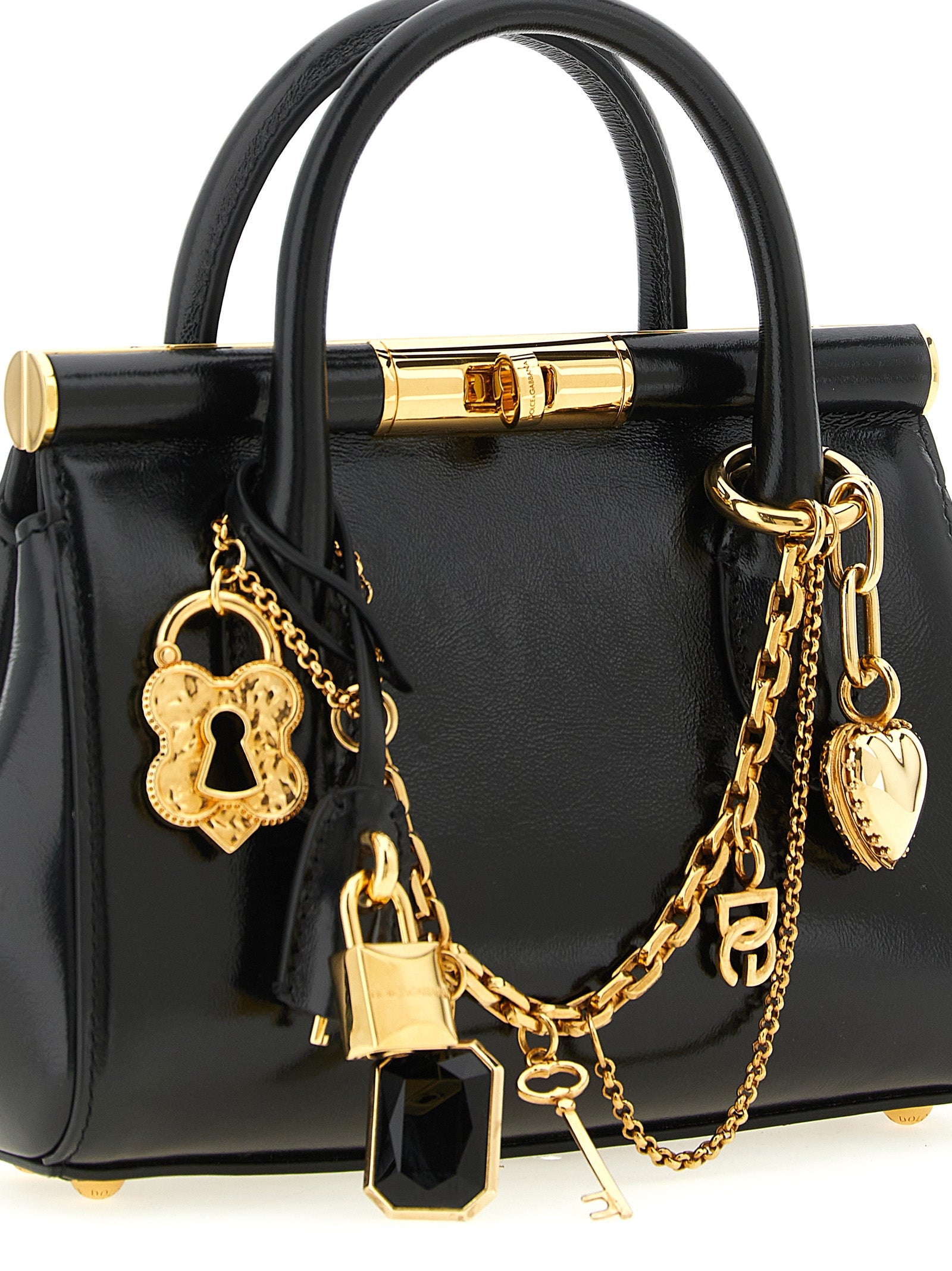 Sac à main en cuir de veau noir de Dolce & Gabbana, élégant et sophistiqué, avec détails en or et design classique.