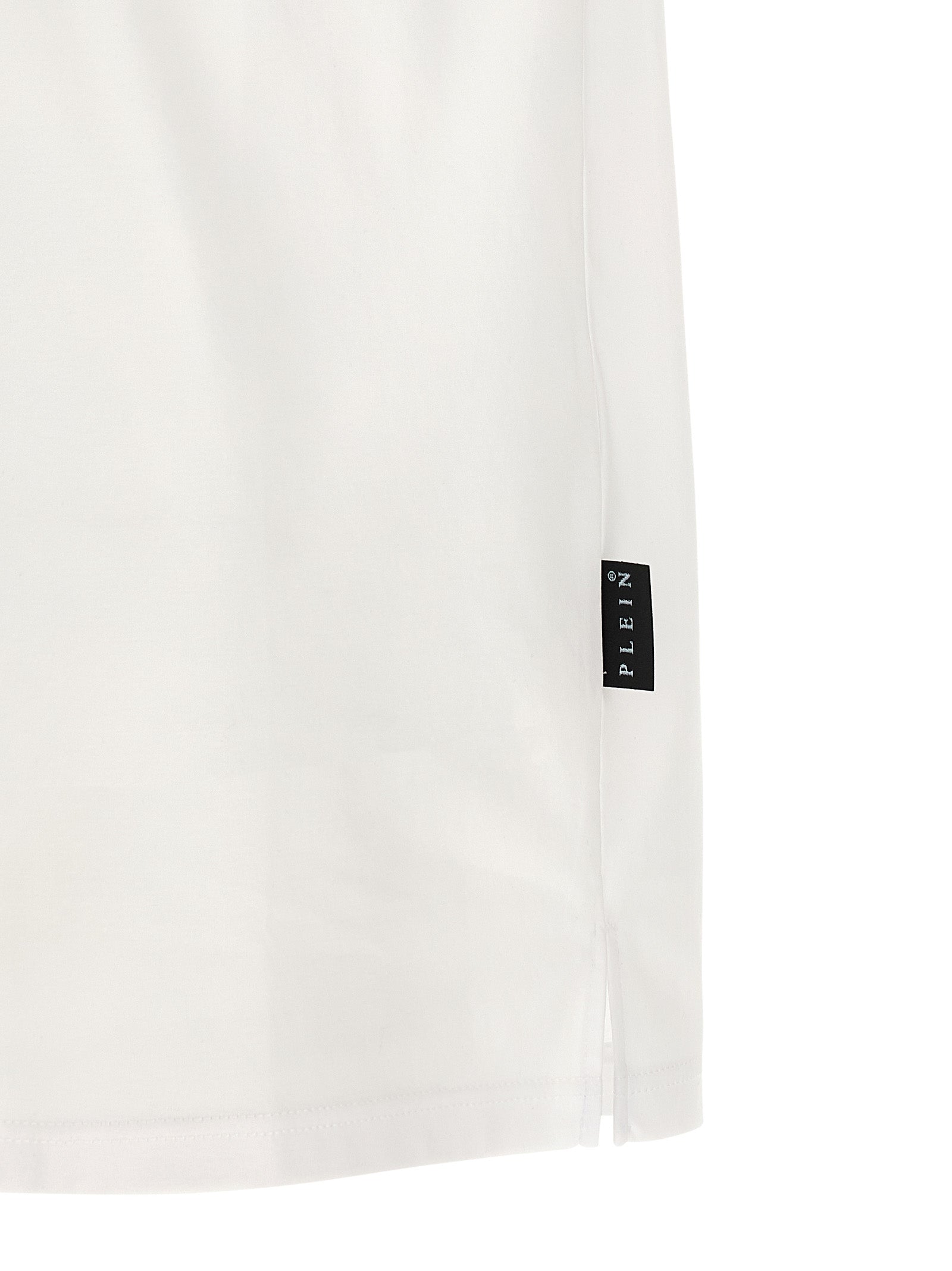 Chemise polo blanche en coton de la marque Philipp Plein, avec logo et détails élégants visibles sur l'image.
