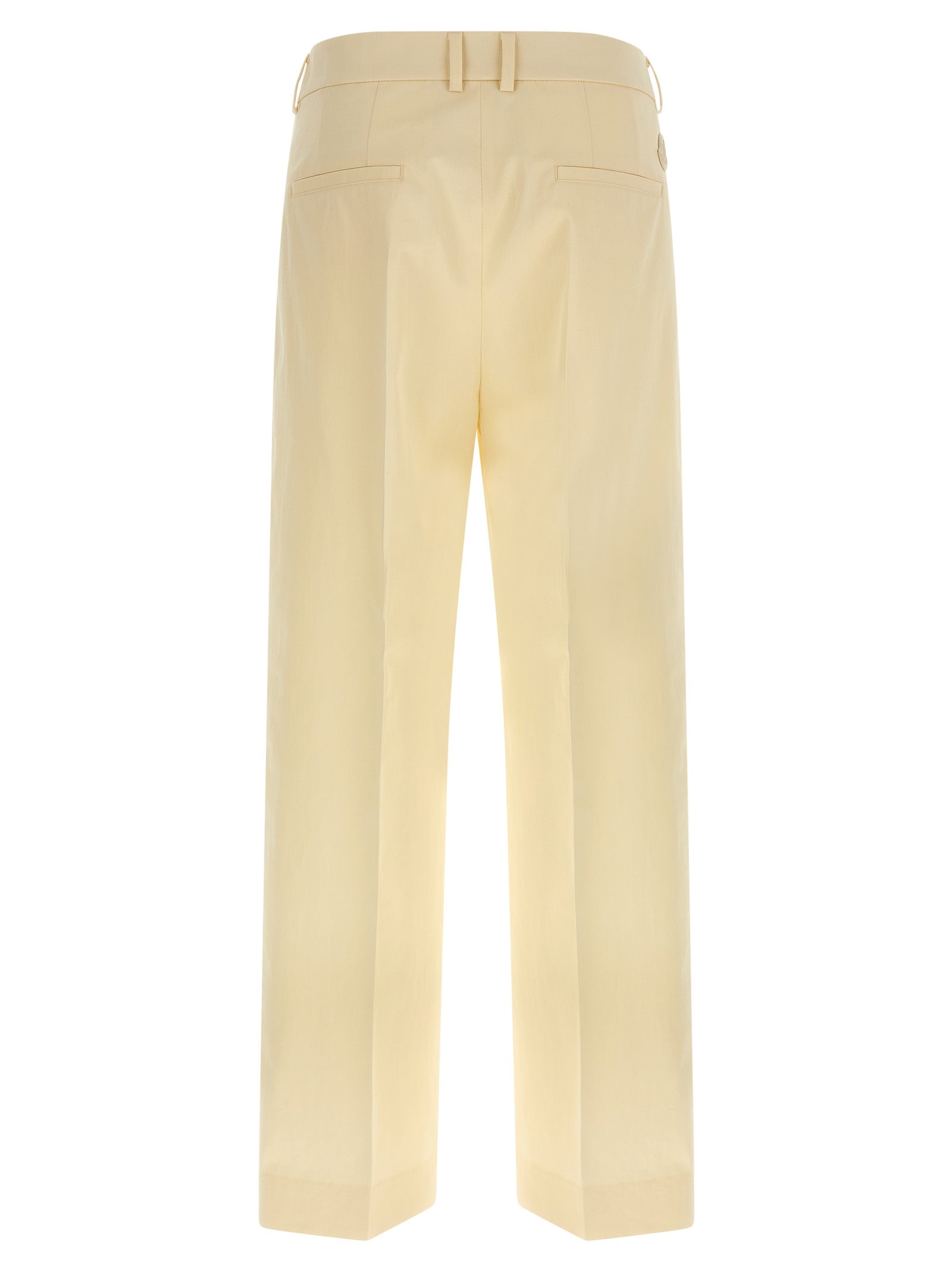 Pantalon beige en coton Moncler pour femme, coupe classique et élégante, visible en détail dans l'image.