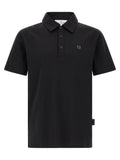 Chemise polo en coton noir Philipp Plein, vue de face, détail du col et du logo brodé, tissu doux et élégant.