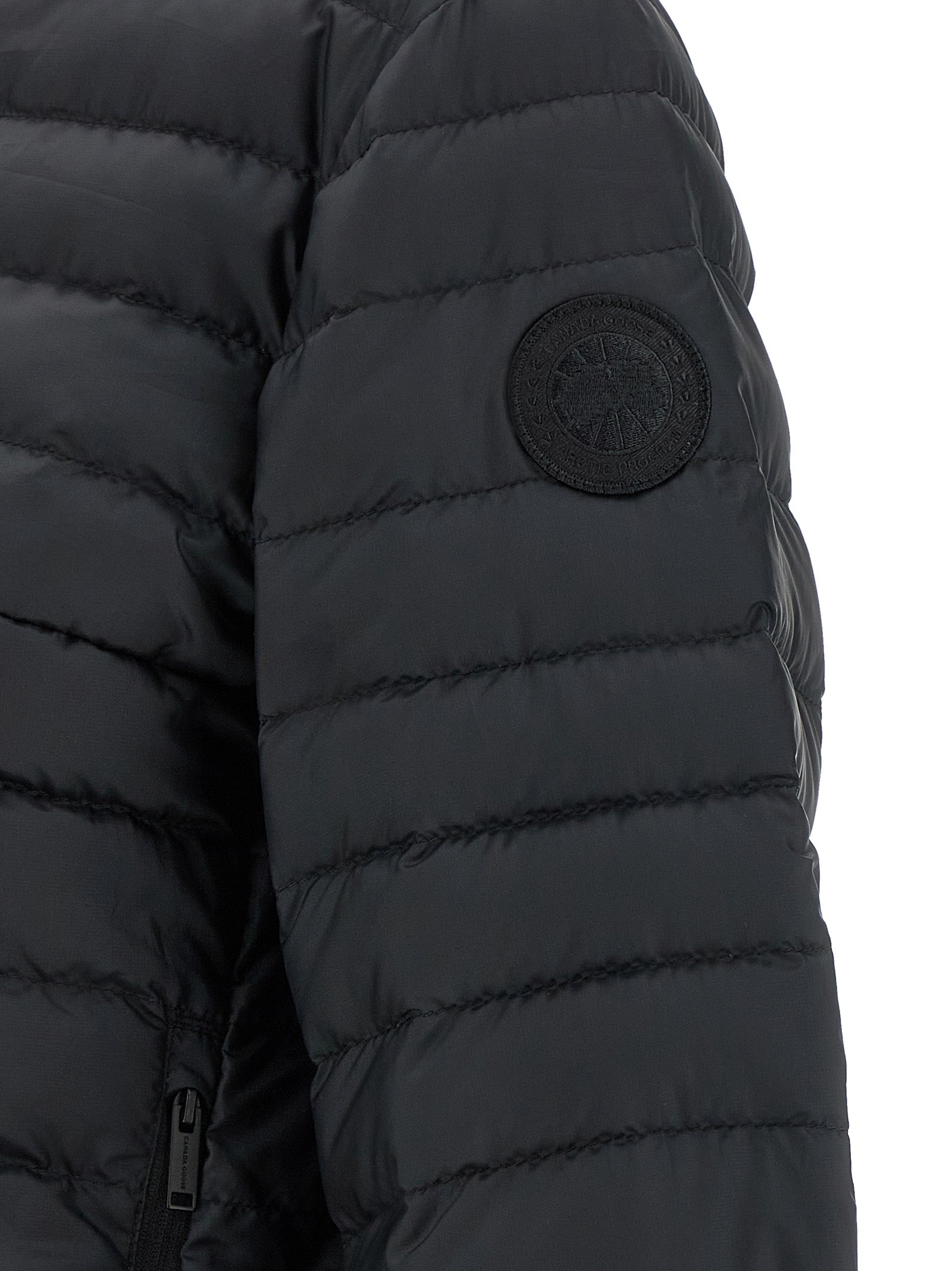 Veste longue en polyamide noire de Canada Goose, design chaud et résistante, visible avec fermeture éclair et capuche ajustable.