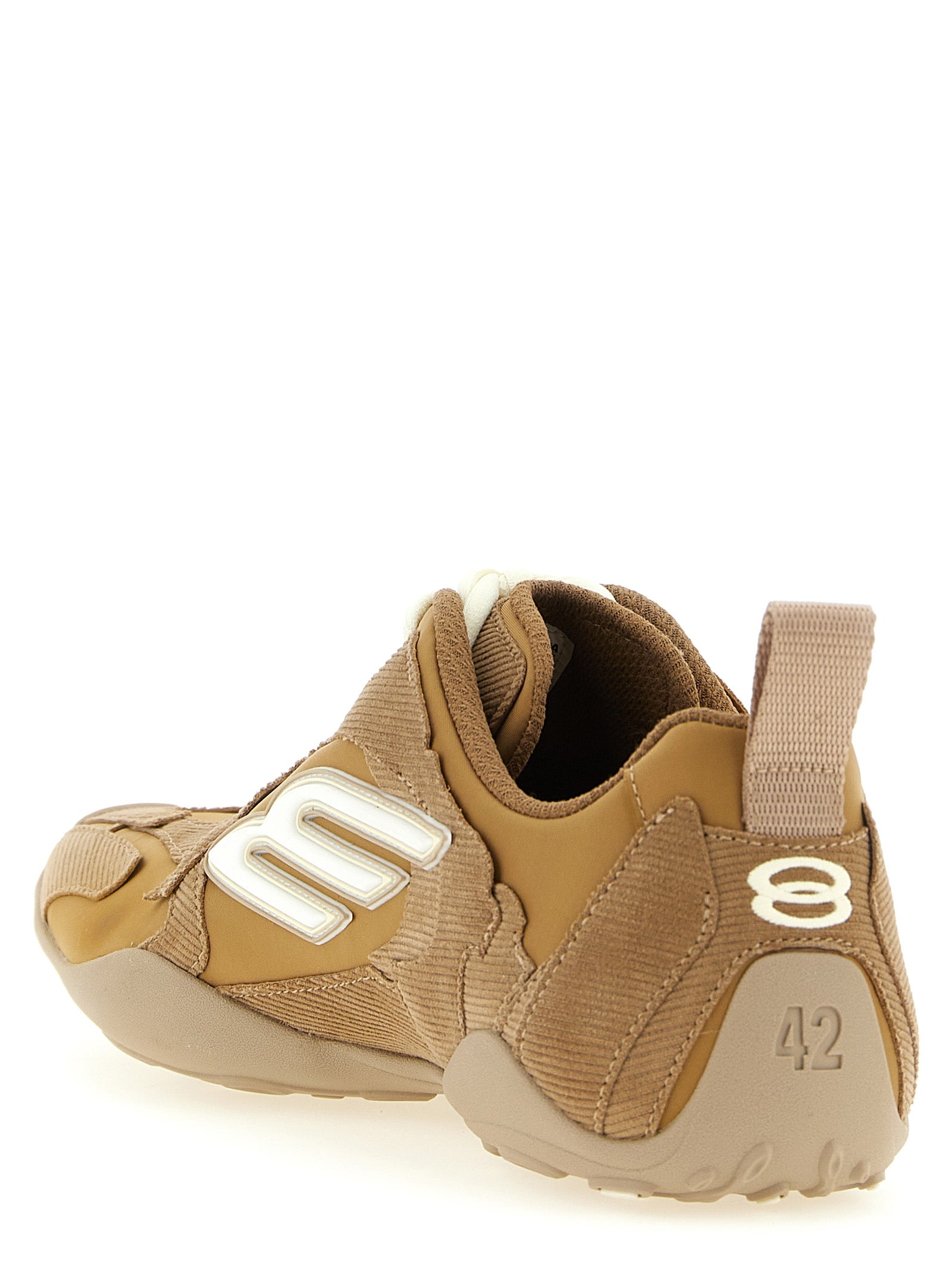 Chaussures de sport Balenciaga en polyester beige, baskets athlétiques avec semelle blanche et design moderne.