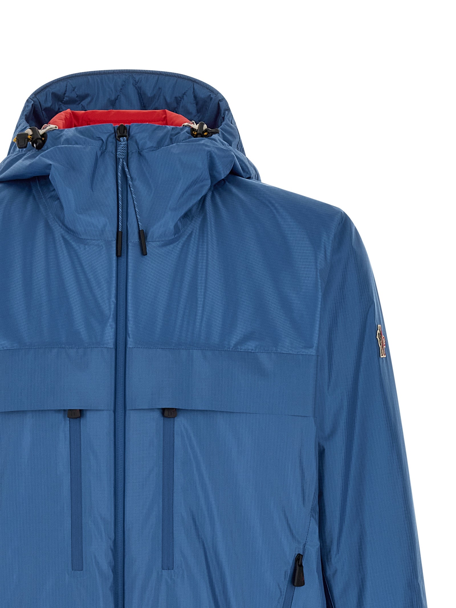Veste Shell en polyamide bleue Moncler Grenoble, coupe-vent et déperlante, avec fermeture éclair et capuche intégrée.