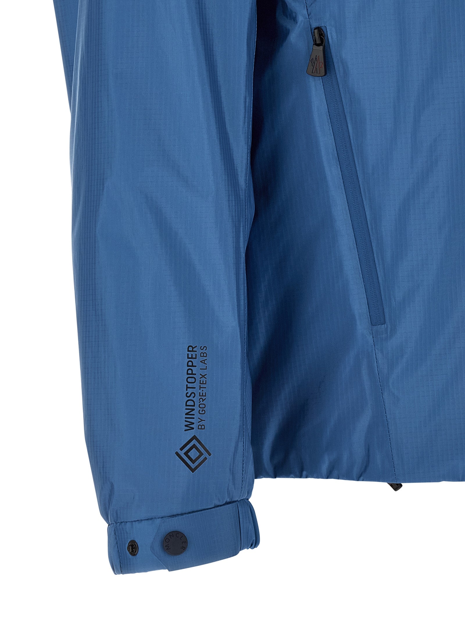Veste en shell en polyamide bleue Moncler Grenoble, coupe-vent et imperméable, avec capuche et fermeture éclair.