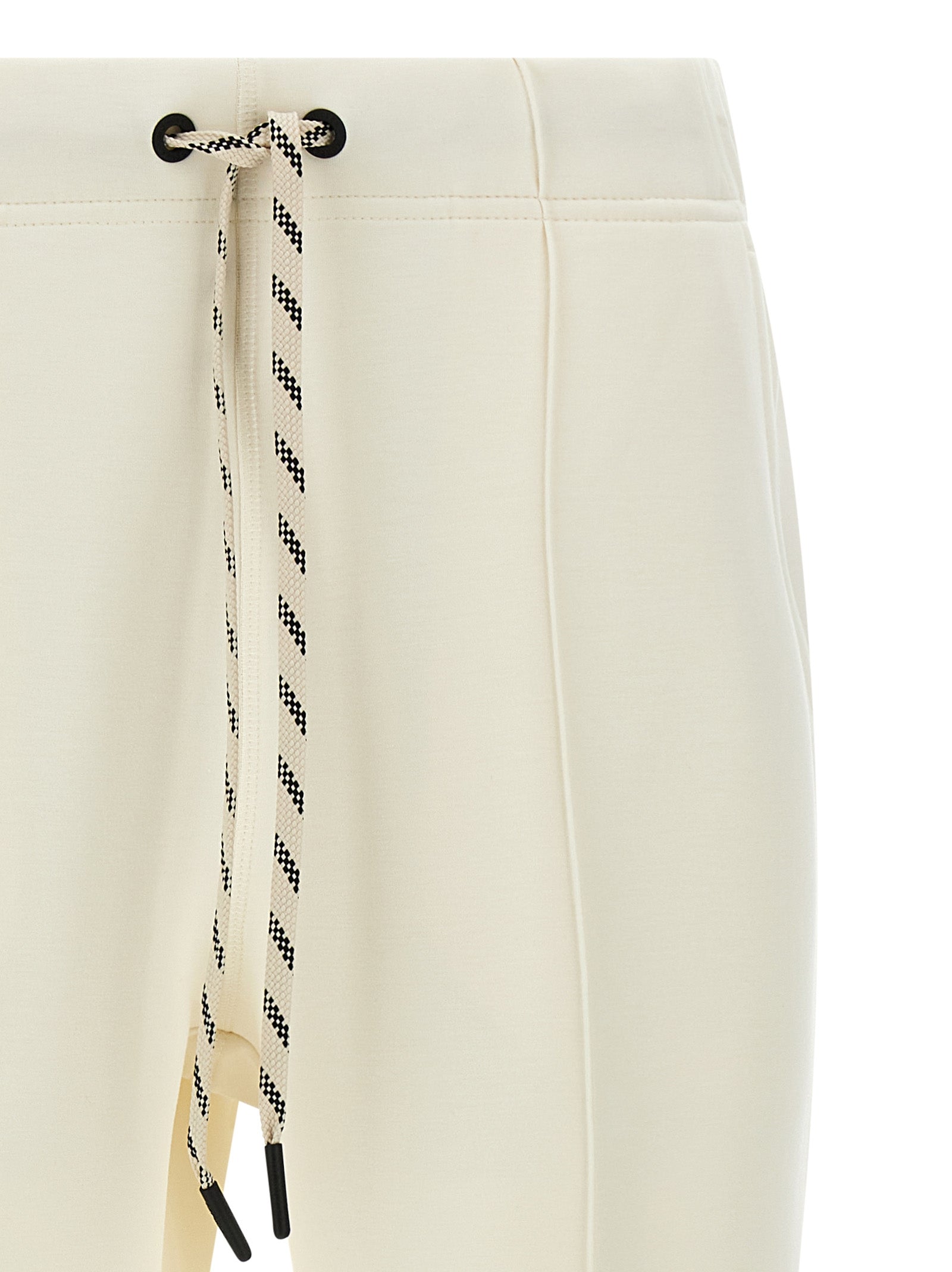 Pantalons de jogging en polyester blanc Moncler Grenoble, vêtements de sport confortables avec logo visible.