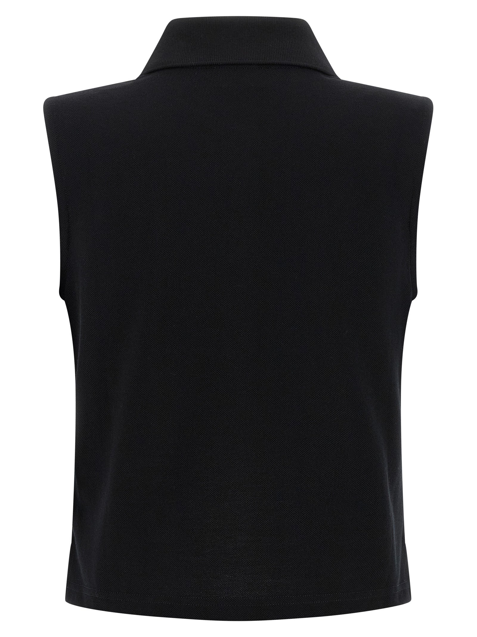 Chemise polo noire en coton de Saint Laurent, détail du col et de la texture du tissu visible.