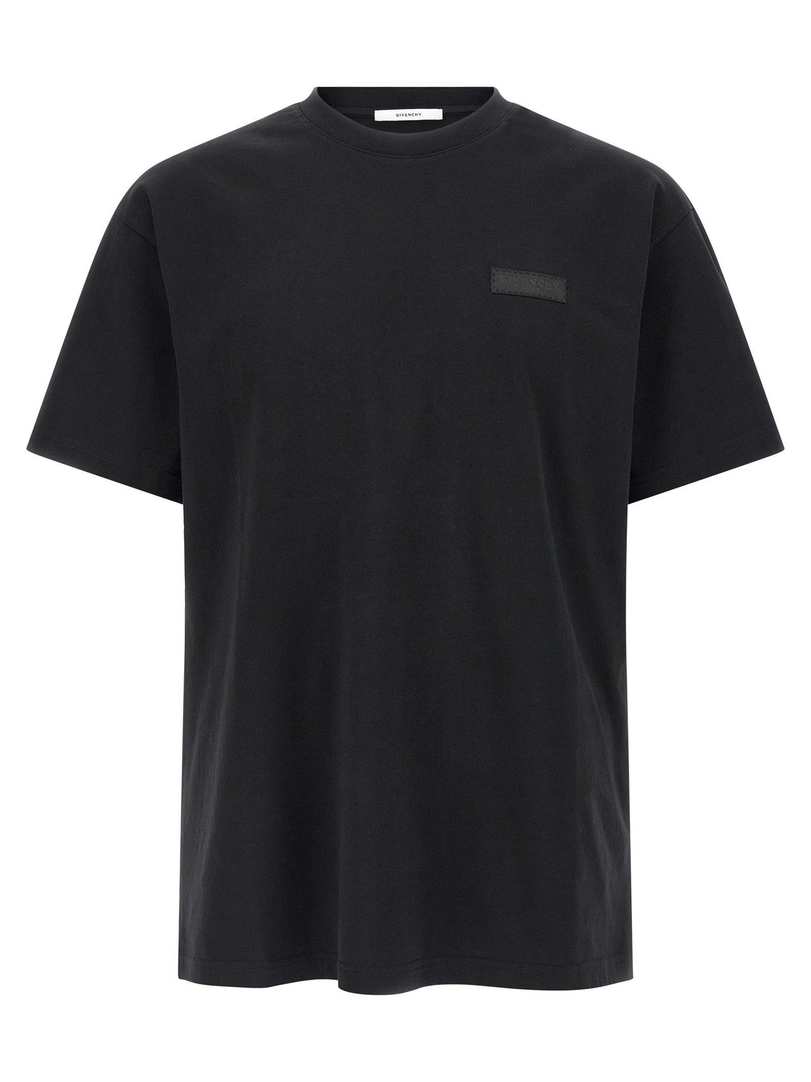 T-shirt noir en coton Givenchy, coupe classique avec logo discret, porté sur mannequin blanc.