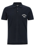 Chemise polo en coton bleu Givenchy, vue de face, avec col boutonné et logo discret sur la poitrine.
