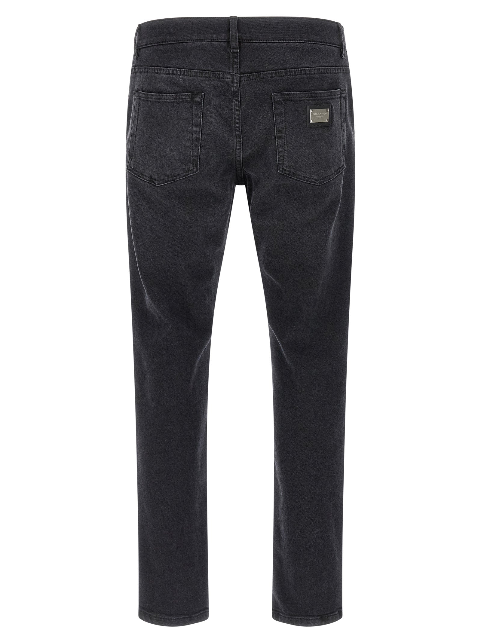 Jeans droits en coton noir de Dolce & Gabbana, style classique, coupe droite, visible en détail sur l'image.