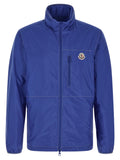 Veste en polyamide bleue Moncler, coupe-vent et imperméable, avec capuche et fermeture zippée.