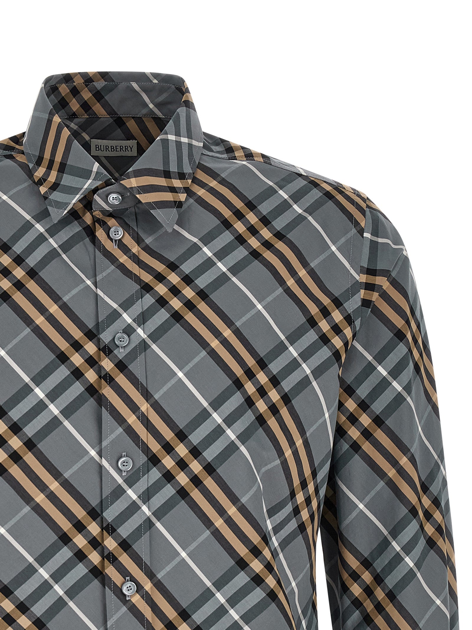 Chemisier en coton multicolore Burberry avec motif à carreaux, manches longues et col classique, porté sur un mannequin.