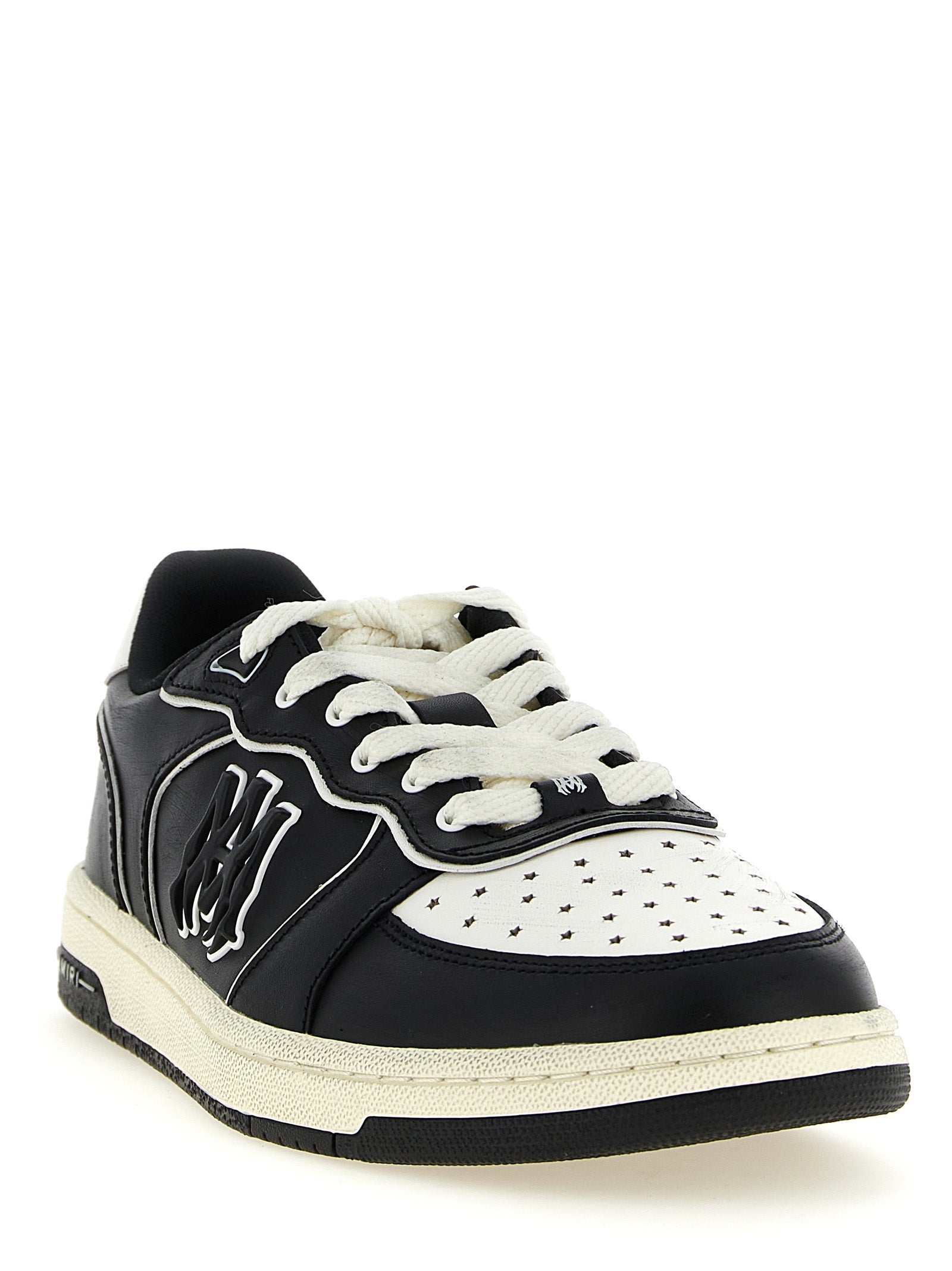 Sneakers basses Amiri en cuir bovin bicolore, style décontracté, avec lacets et semelle en caoutchouc.