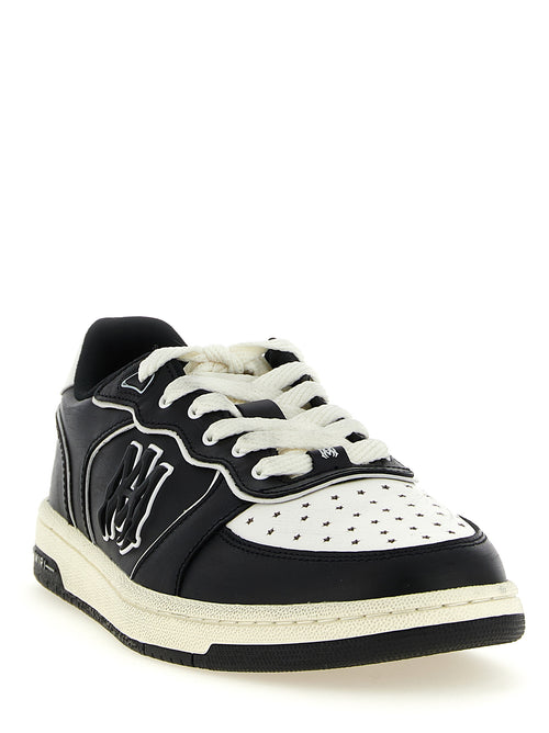 Sneakers basses Amiri en cuir bovin bicolore, style décontracté, avec lacets et semelle en caoutchouc.