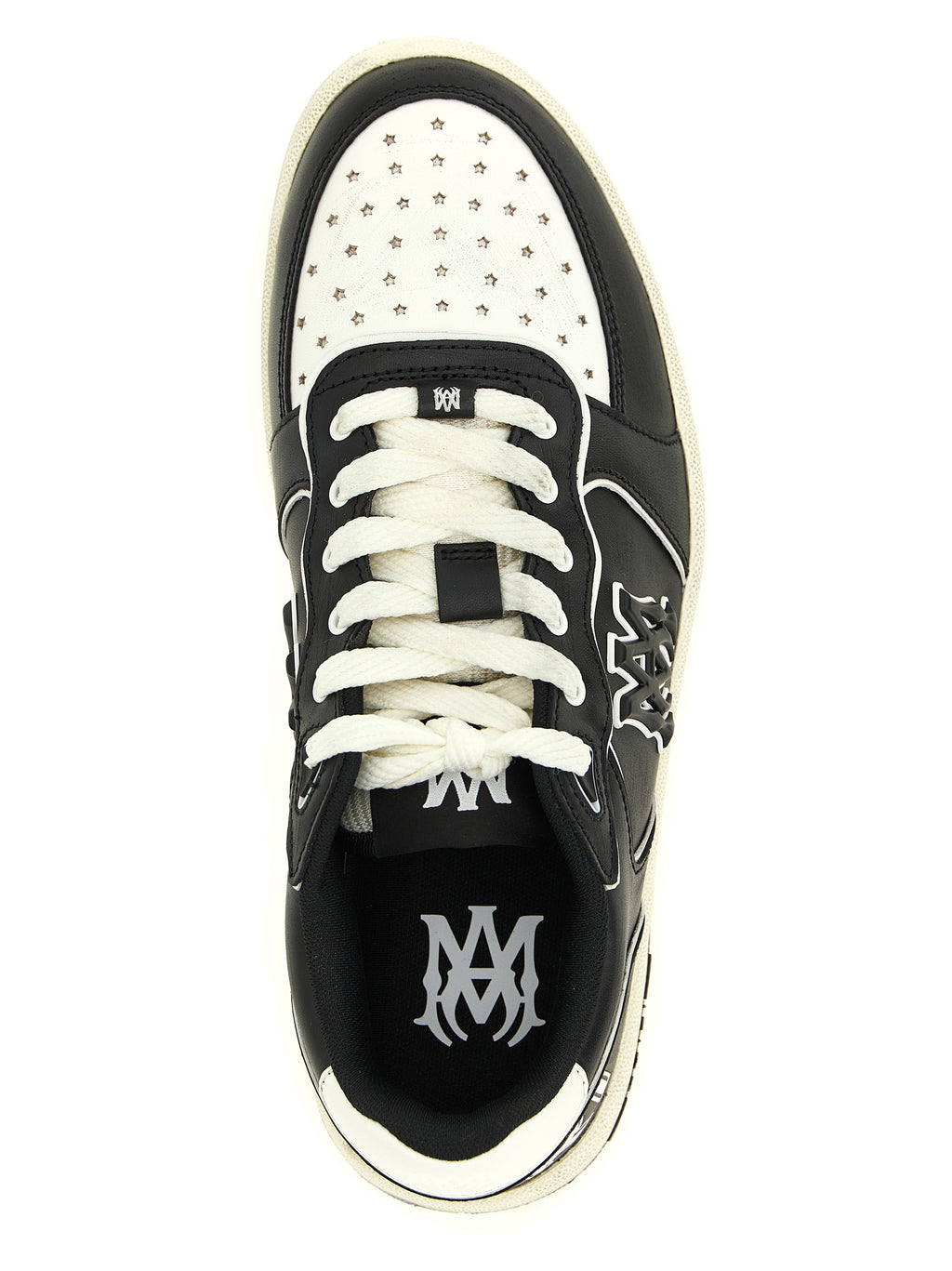 Sneakers basses Amiri en cuir bovin bicolore, style décontracté et moderne, visibles en gros plan.