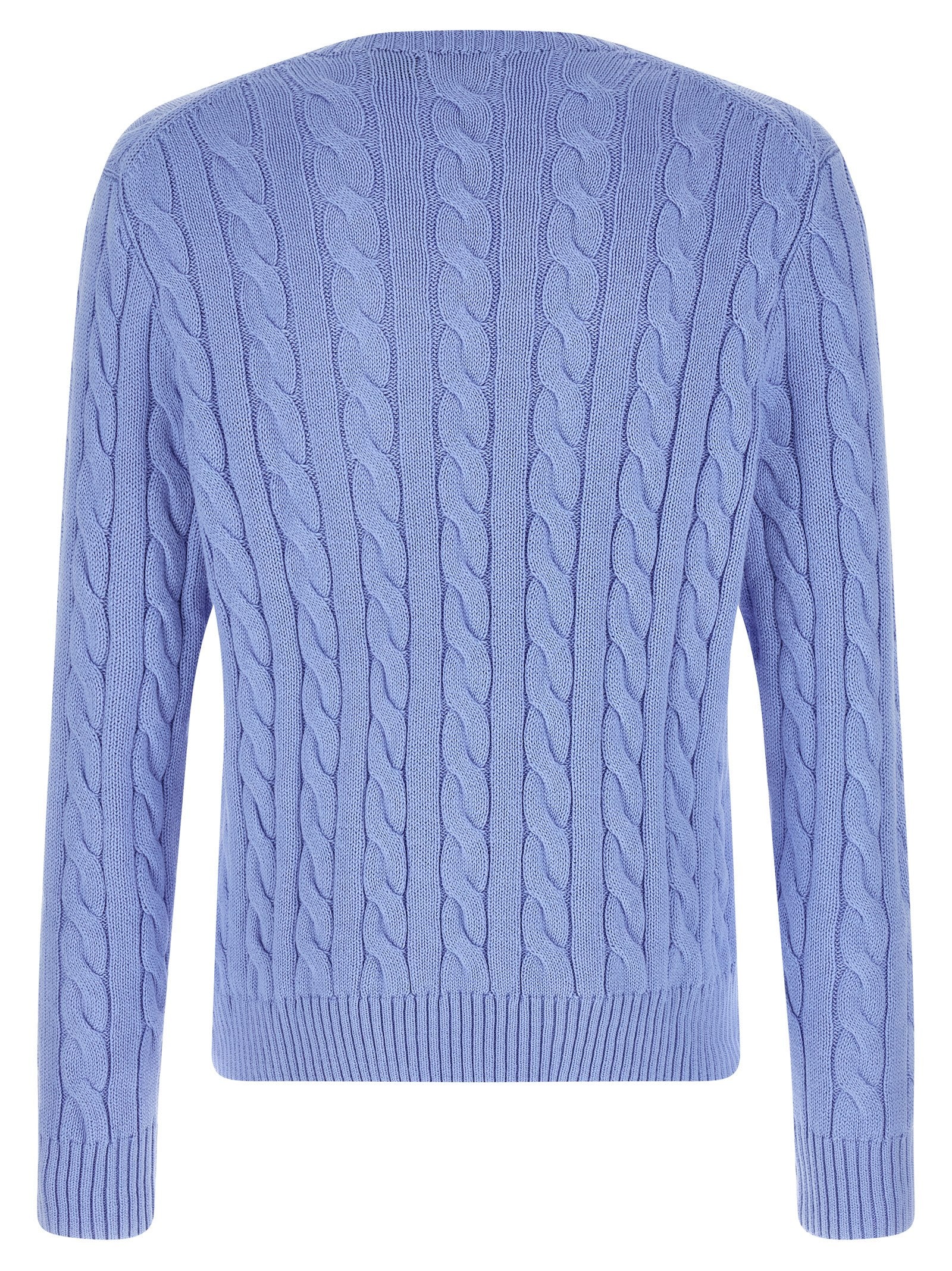 Cardigan en coton bleu Polo Ralph Lauren porté, avec col en V et boutons, style classique et élégant.