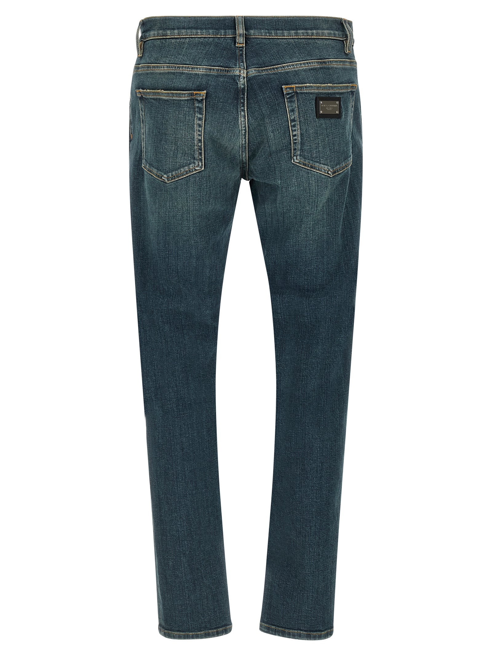 Jeans slim en coton bleu Dolce & Gabbana, coupe ajustée, détails modernes, porté avec style et confort.