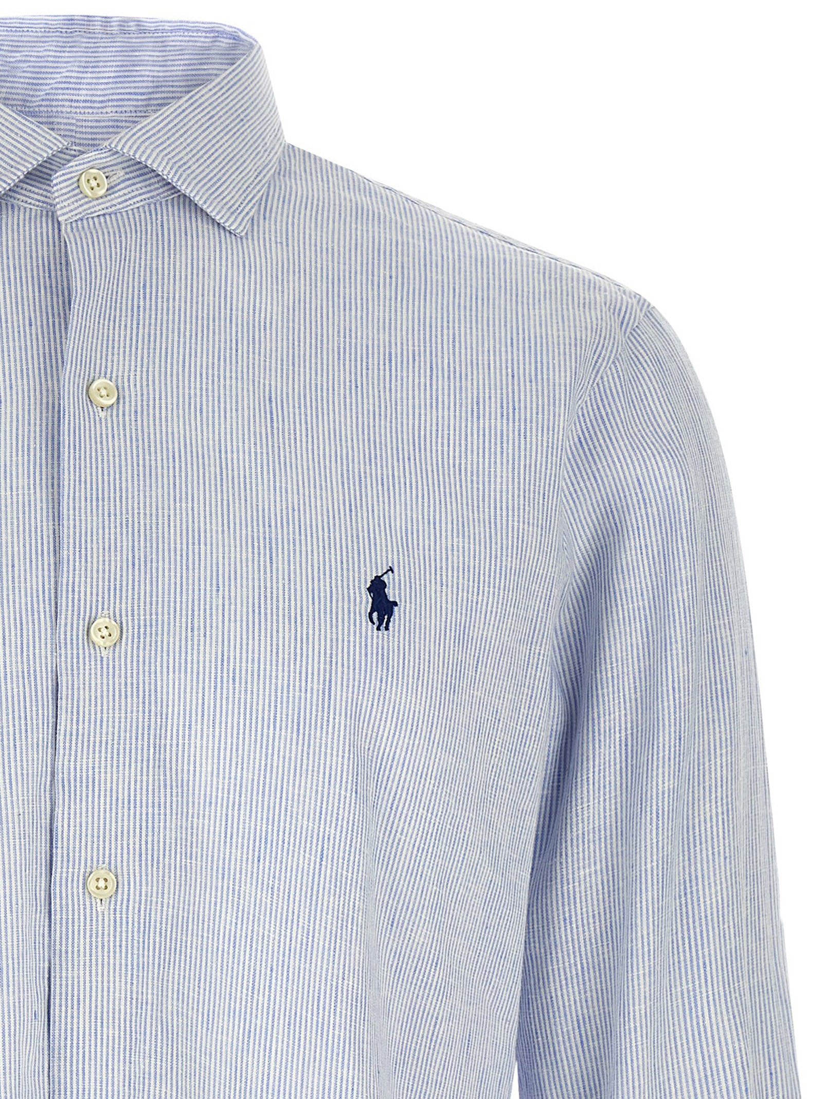 Chemisier en lin bleu Polo Ralph Lauren, coupe élégante, détails de couture visibles, parfait pour un style sophistiqué.