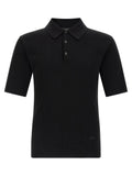 Chemise polo noire en coton Dolce & Gabbana, vue de face, détail du col et du logo brodé, style élégant et classique.