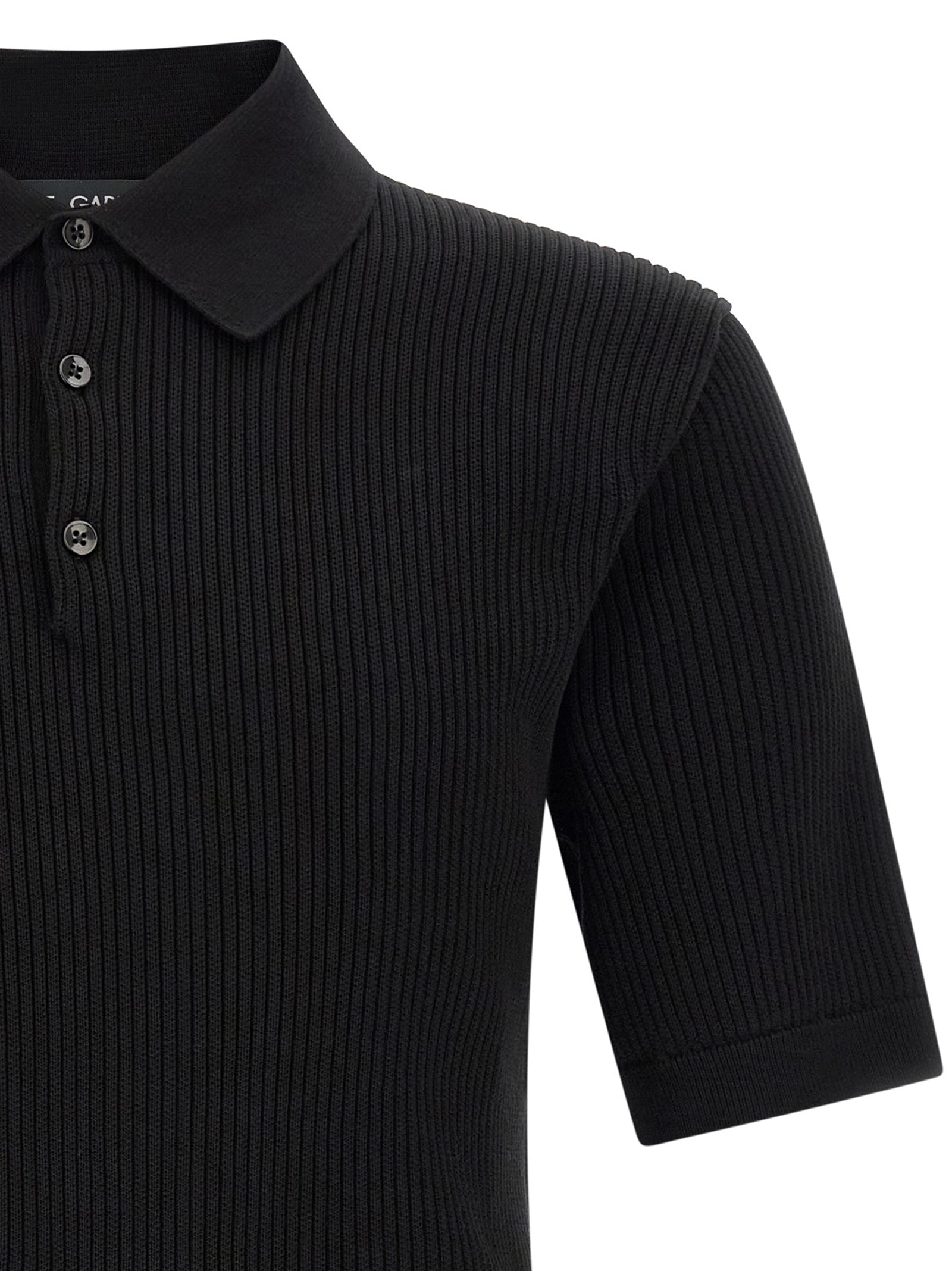 Chemise polo en coton noir de Dolce & Gabbana, style élégant avec col et boutons, vue de face.