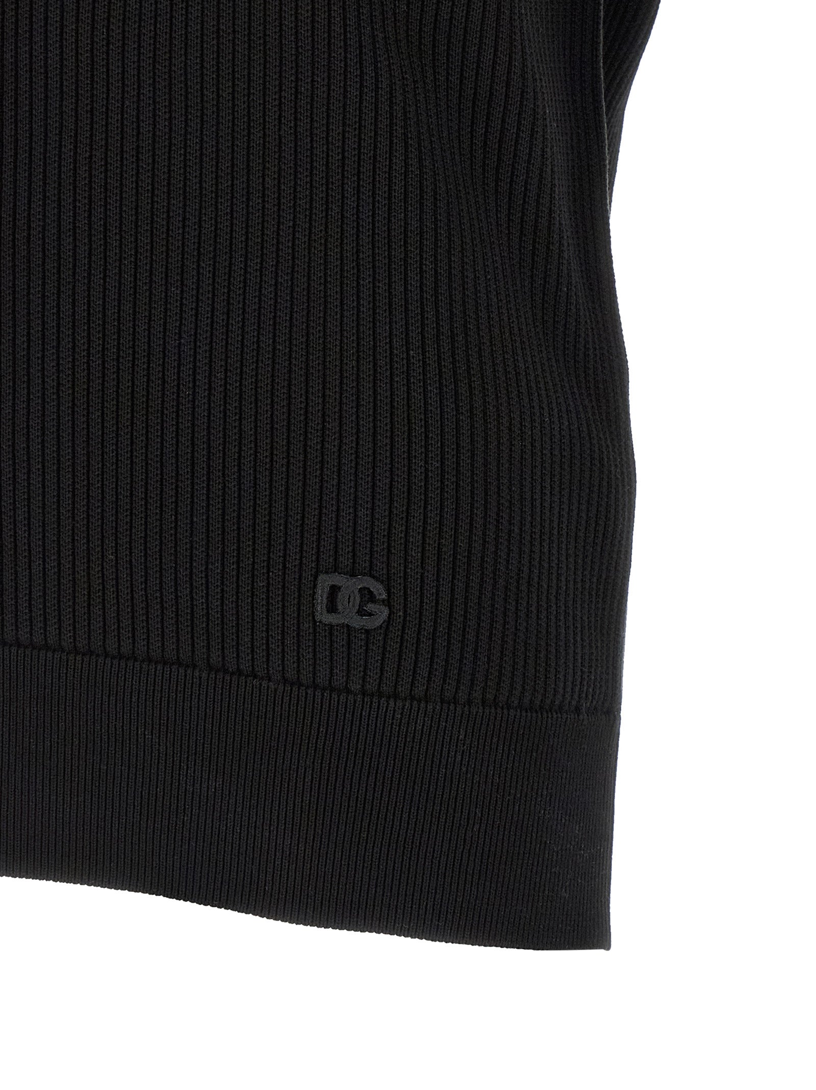 Chemise polo en coton noir Dolce & Gabbana, vue de face, avec col classique et logo discret sur la poitrine.