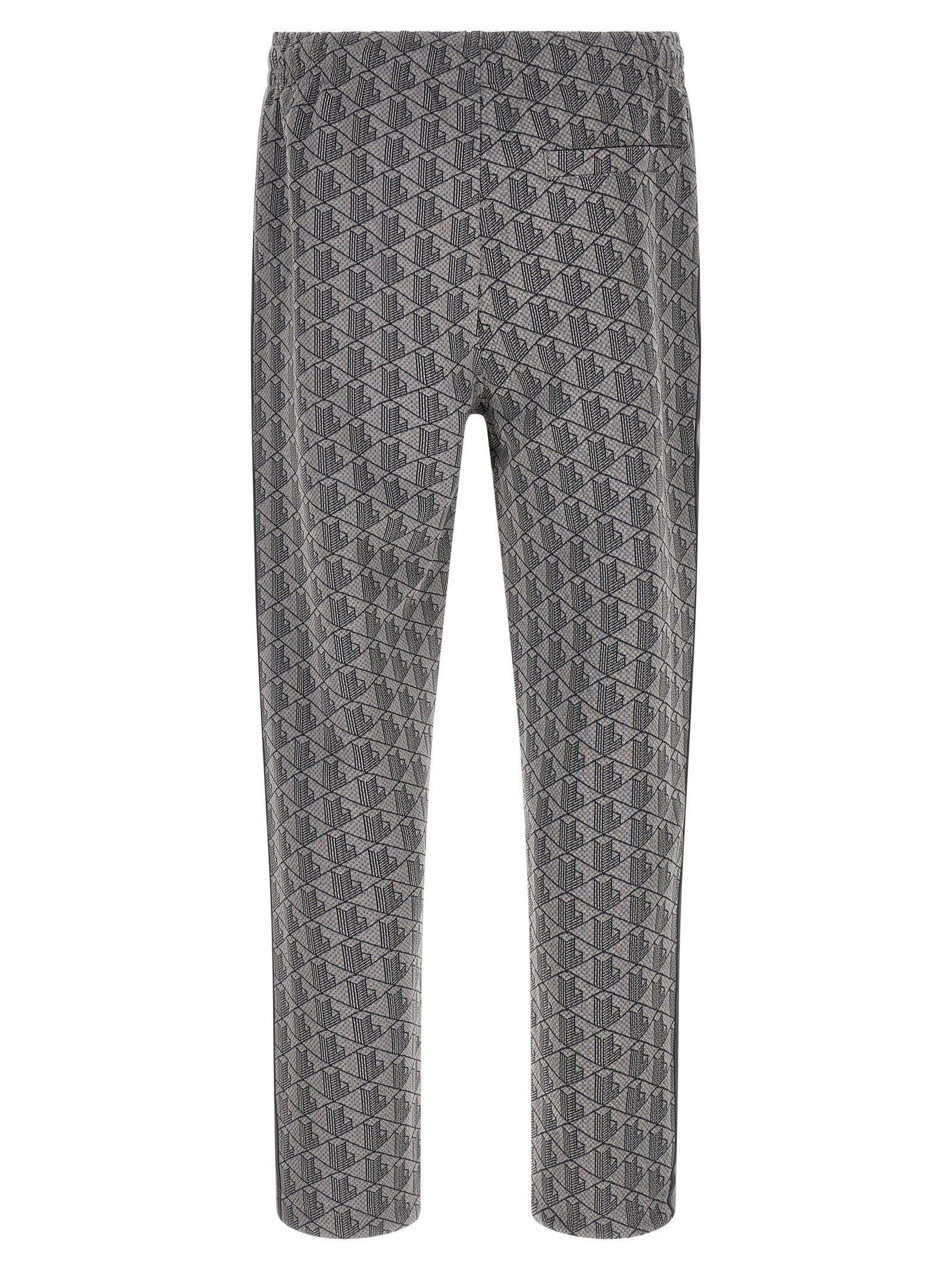 Pantalons de jogging en polyester gris de Lacoste, style décontracté pour entraînement ou détente, avec logo Lacoste visible.